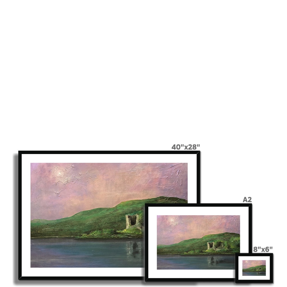 Framed landscape print of a lake, hills, and castle ruins under a pink and purple sky
