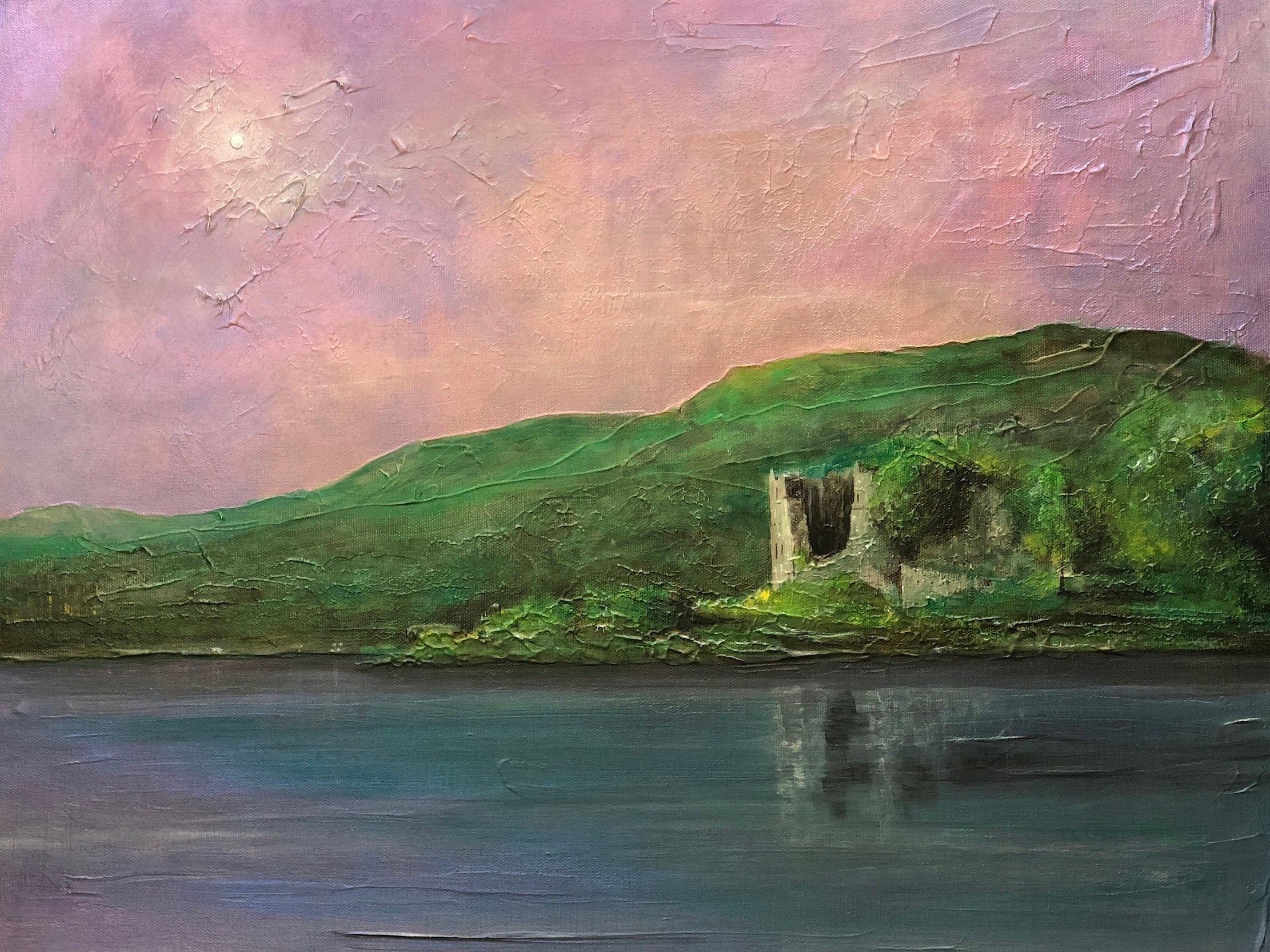 Oil painting of a ruined Scottish castle on a hillside overlooking water at sunset