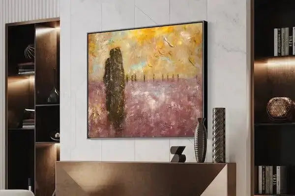 Modern abstract painting with pink and yellow hues, black frame.