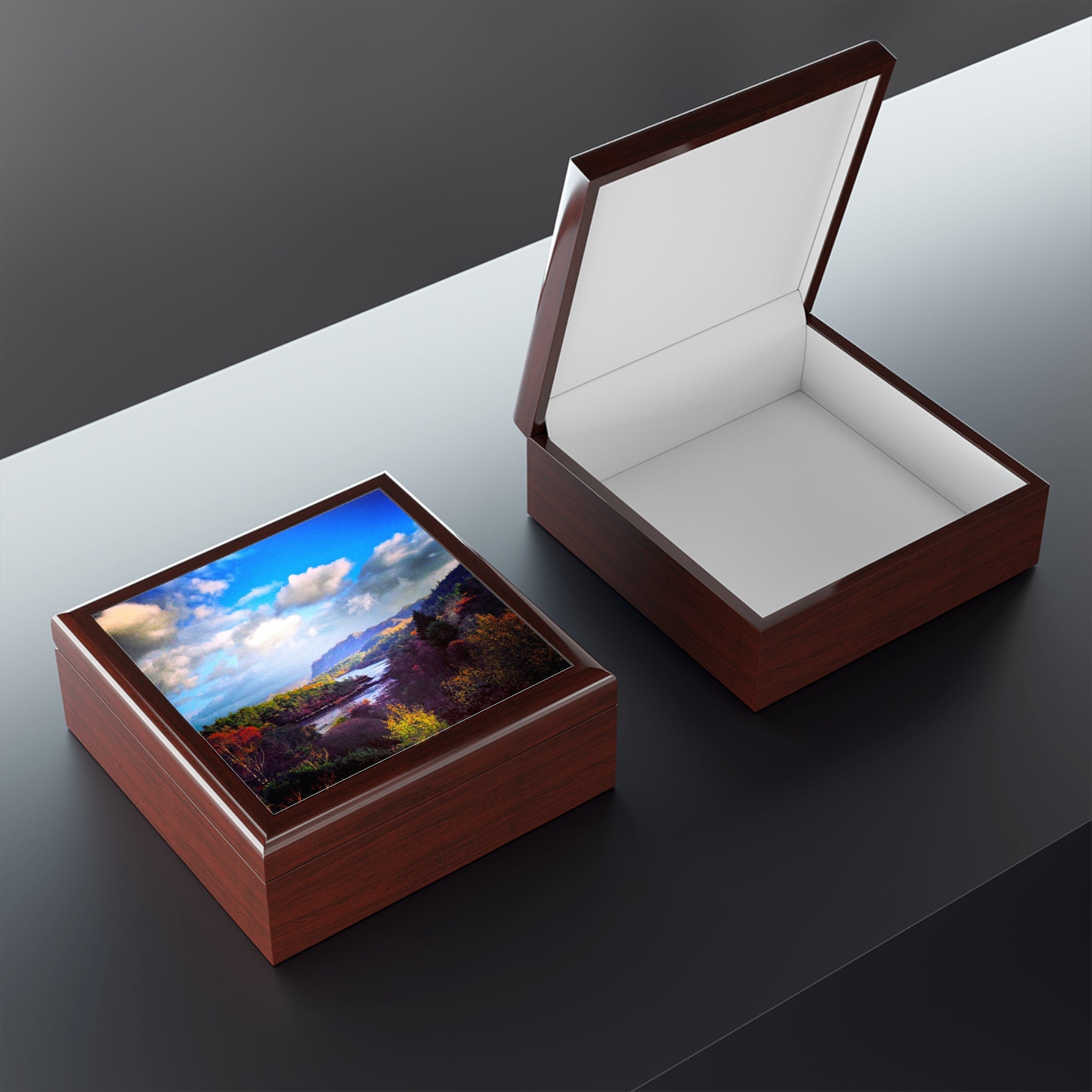 Two wooden keepsake boxes, one closed with landscape lid, one open showing white interior, Plockton Art Jewellery Box Scotland
