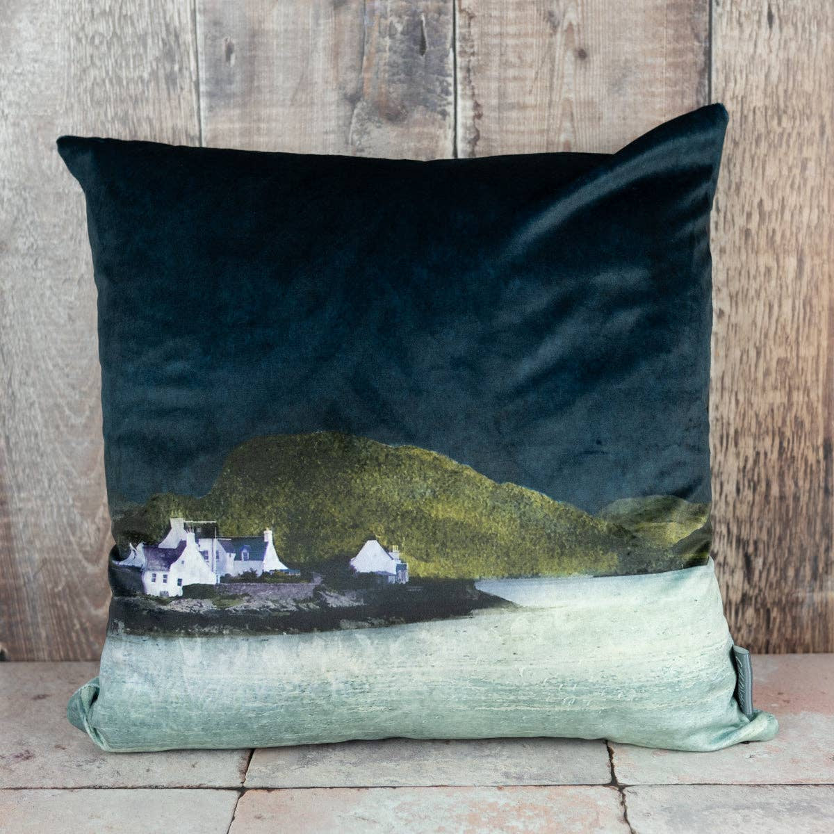 Dark teal Plockton velvet cushion with Cath Waters Scottish cottages landscape
