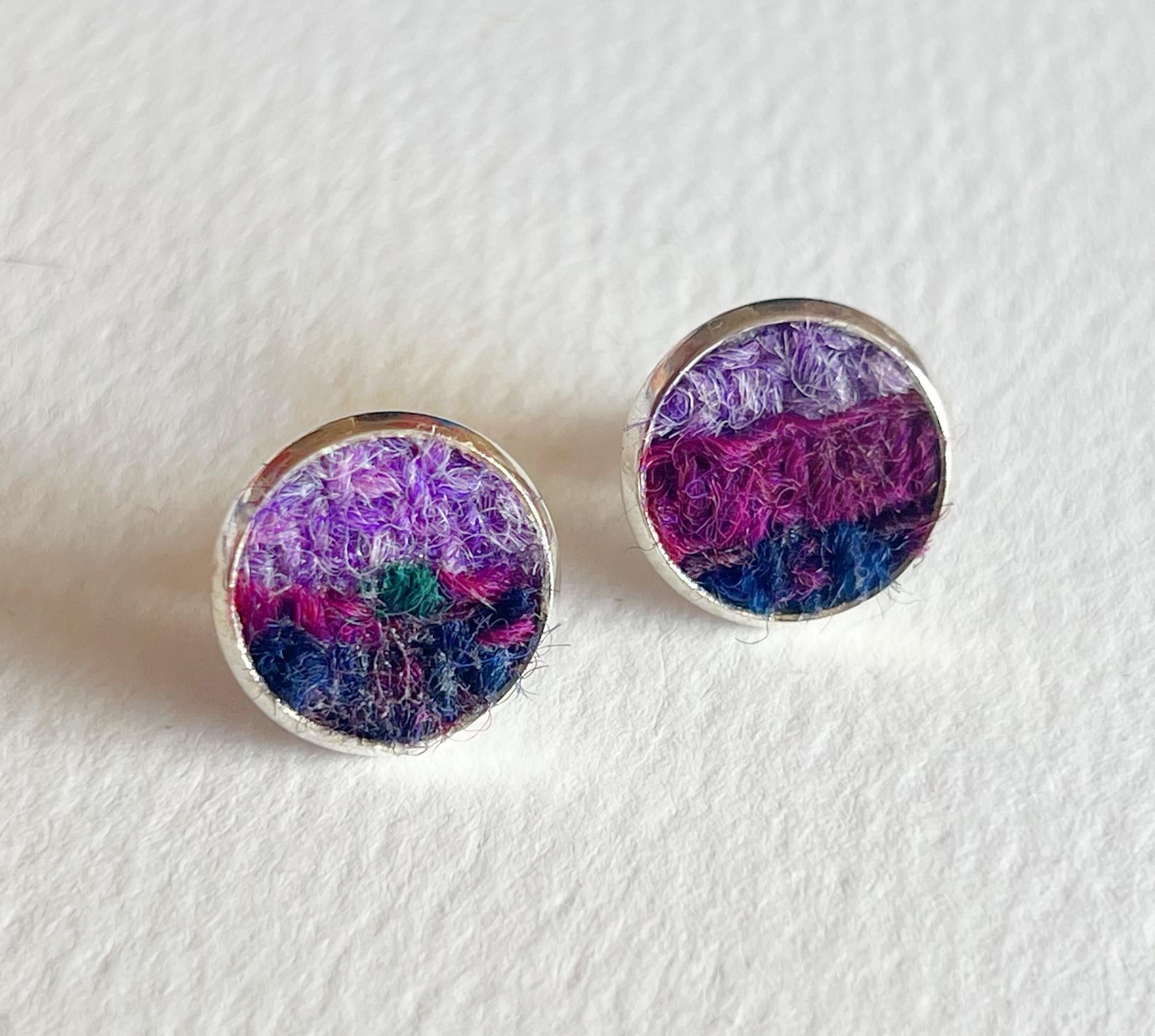Purple Ombre Patchwork Harris Tweed Stud Earrings with round silver rims and abstract purple, magenta, and dark blue fibrous textures