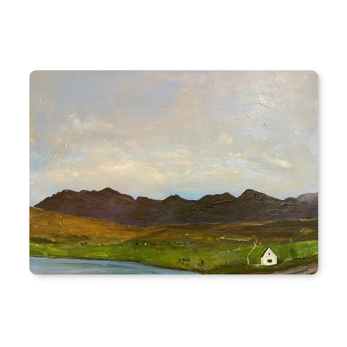 The Road To Carbost placemat: white cottage in green fields, mountains, cloudy sky