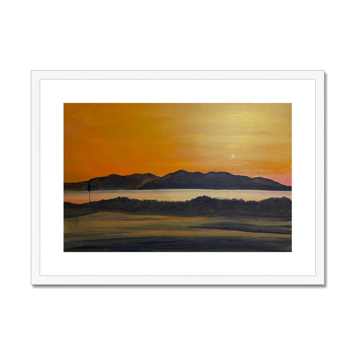 Framed sunset painting over mountains and water displayed in Royal Troon Golf Course print