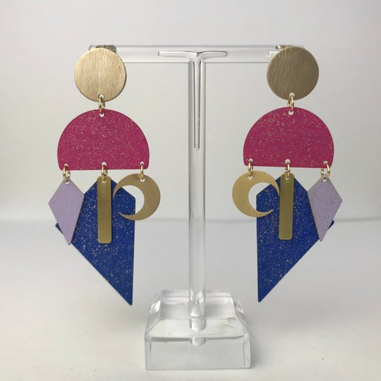 Santa Cruz Carnival earrings by Lindsay Mcdowall Jewellery, gold circular top with pink blue glitter semi-circles and lavender diamond accents