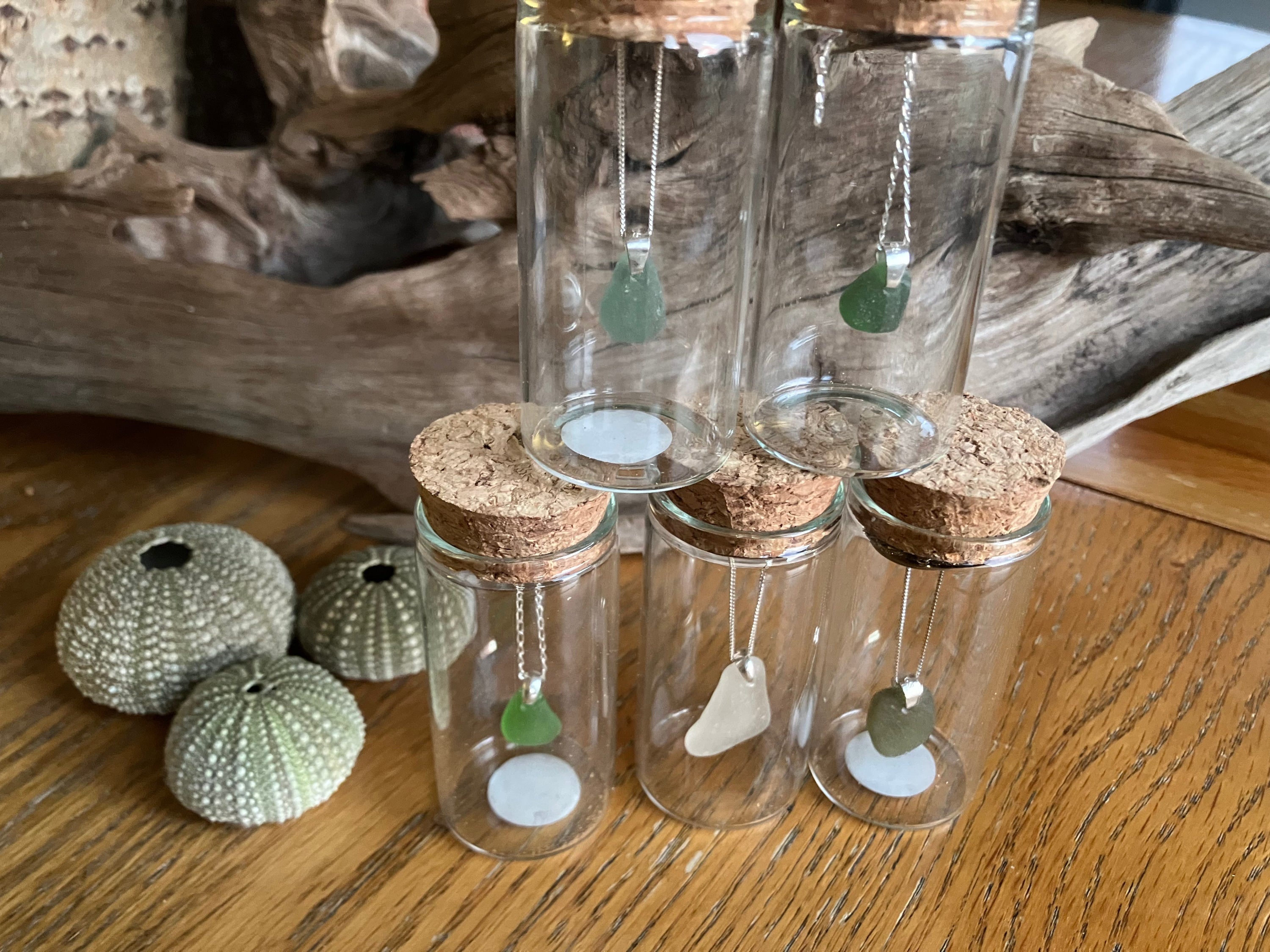 Seaglass Mermaids Tears 925 necklaces in clear cork-stoppered bottles