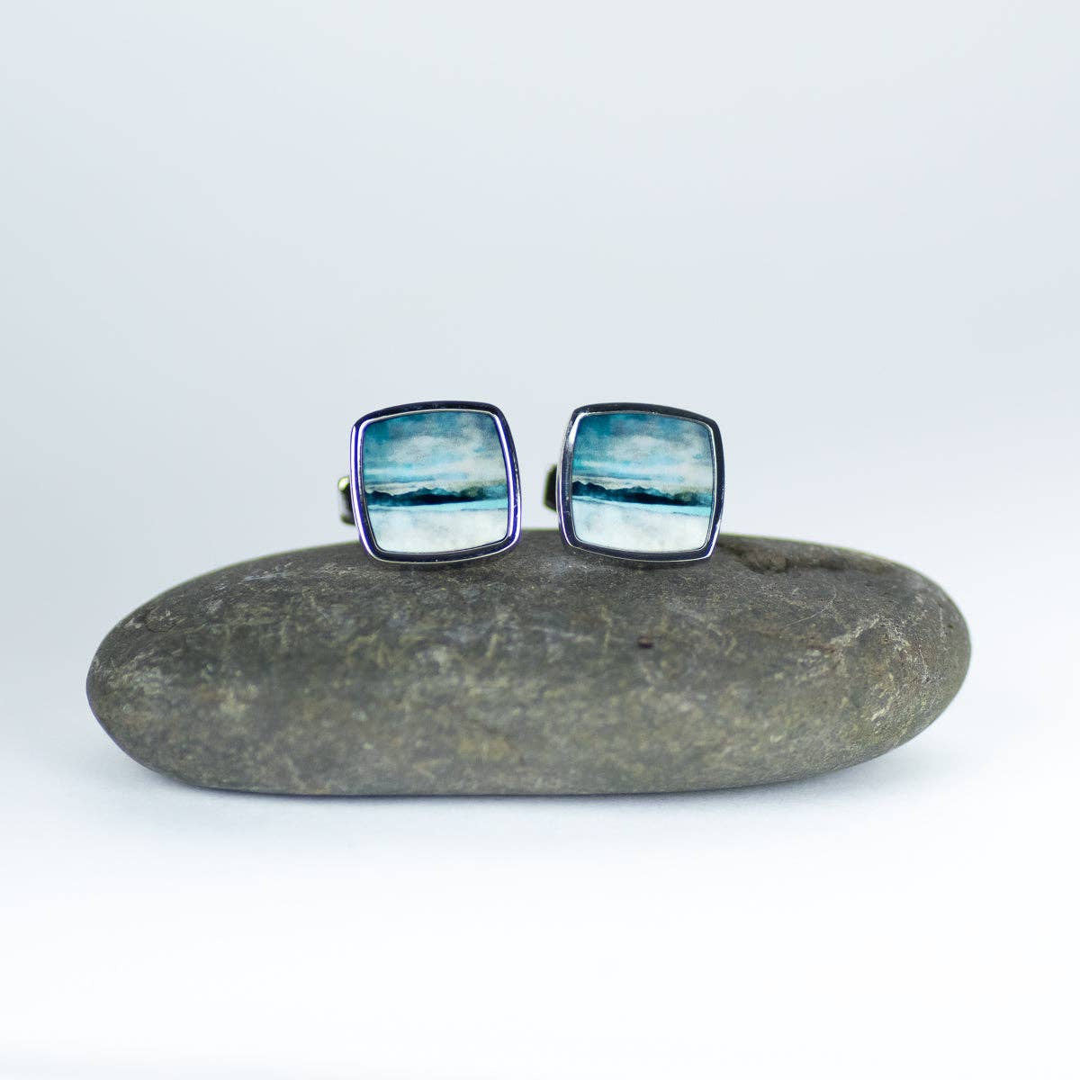 Square cufflinks with blue-white ocean scene, silver border, Skye Bealach Na Ba Applecross by Cath Waters
