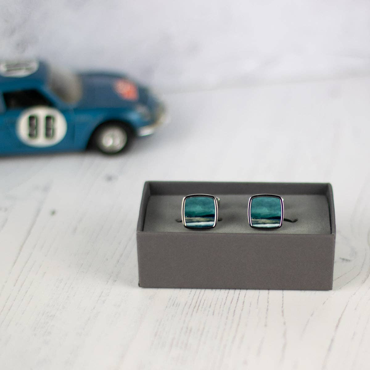 Square Skye cufflinks with teal ocean scene in silver frames, Cath Waters