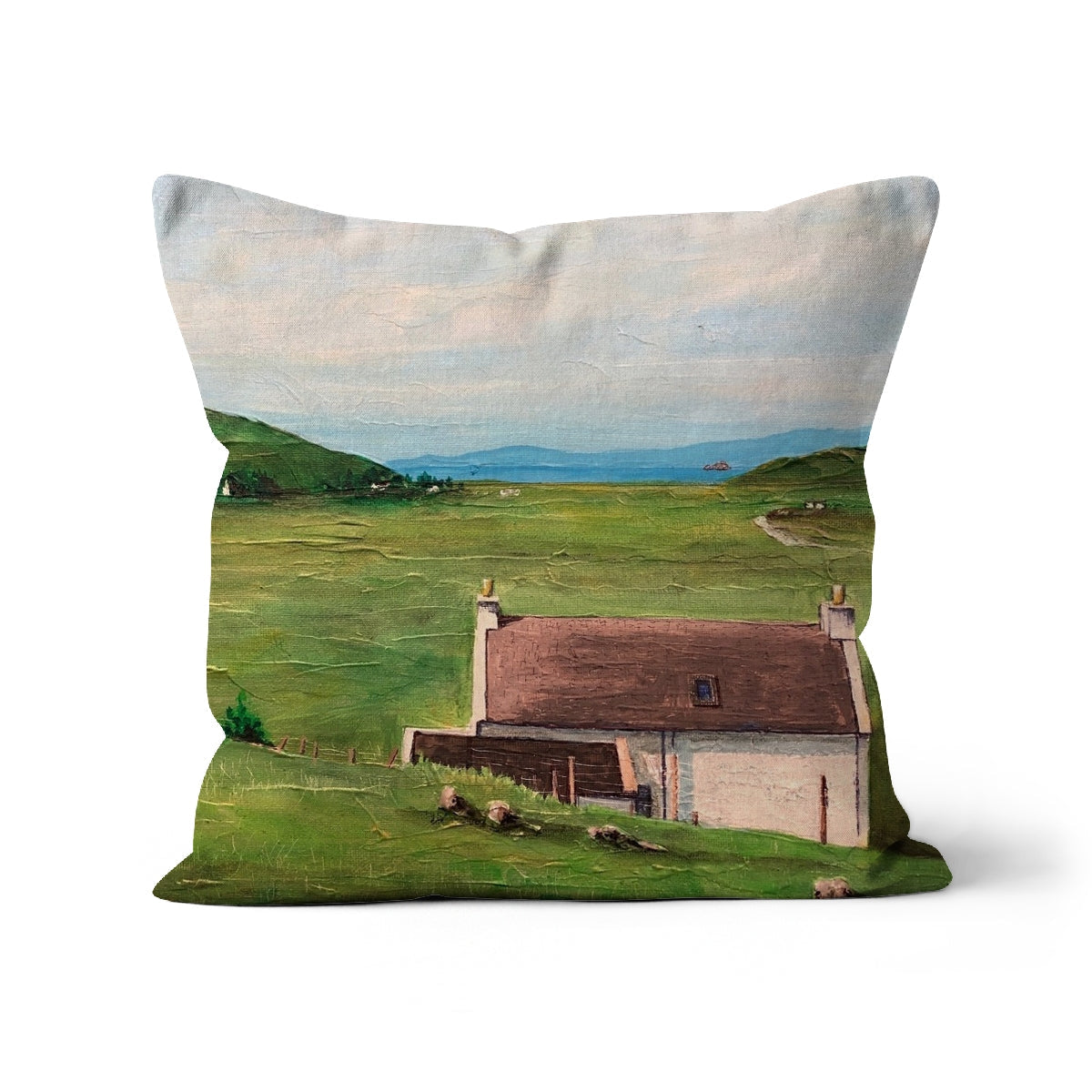Decorative Skye Cottage Cushion featuring a pastoral landscape painting on a throw pillow
