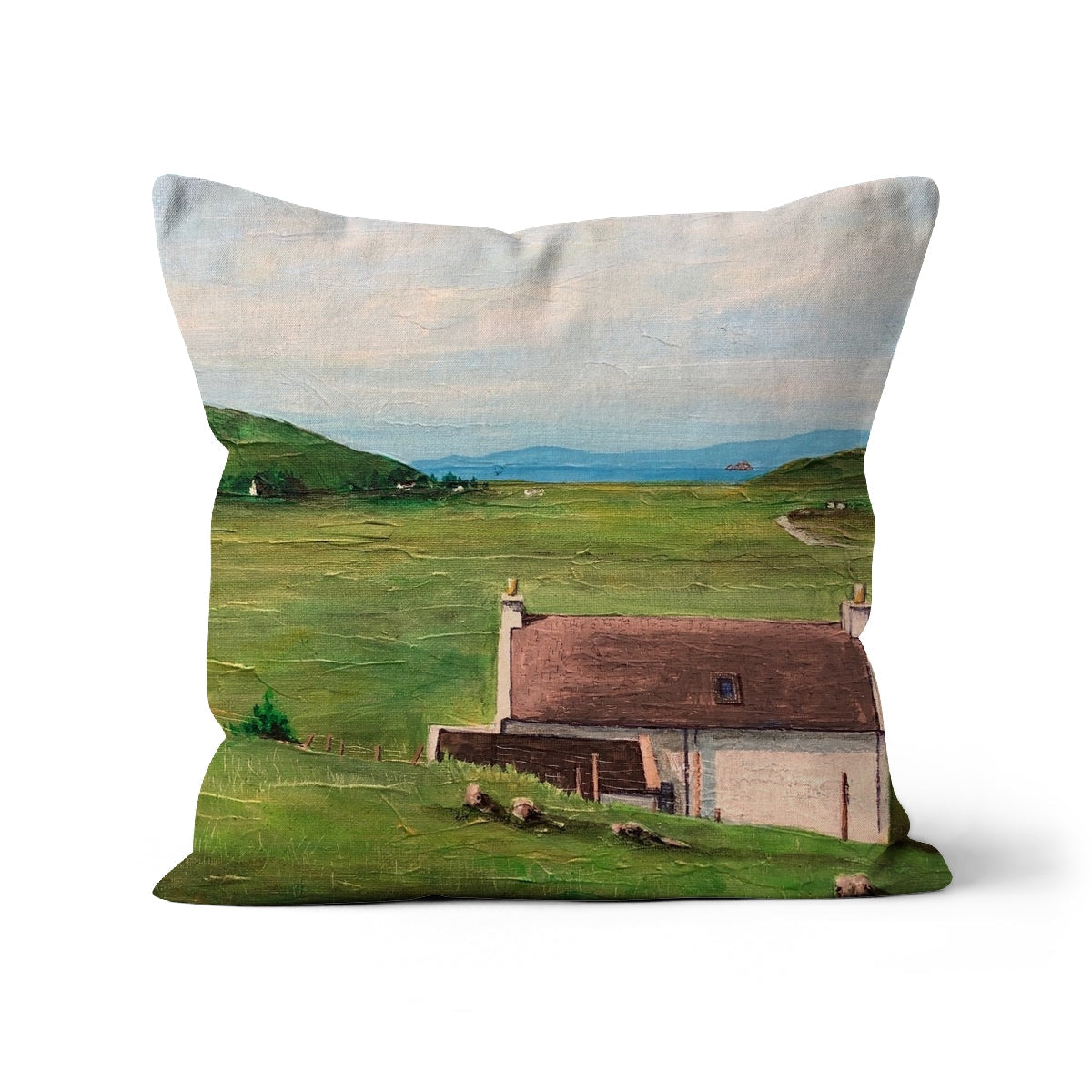 Square Skye Cottage Cushion with painted rural house landscape in green field under cloudy sky
