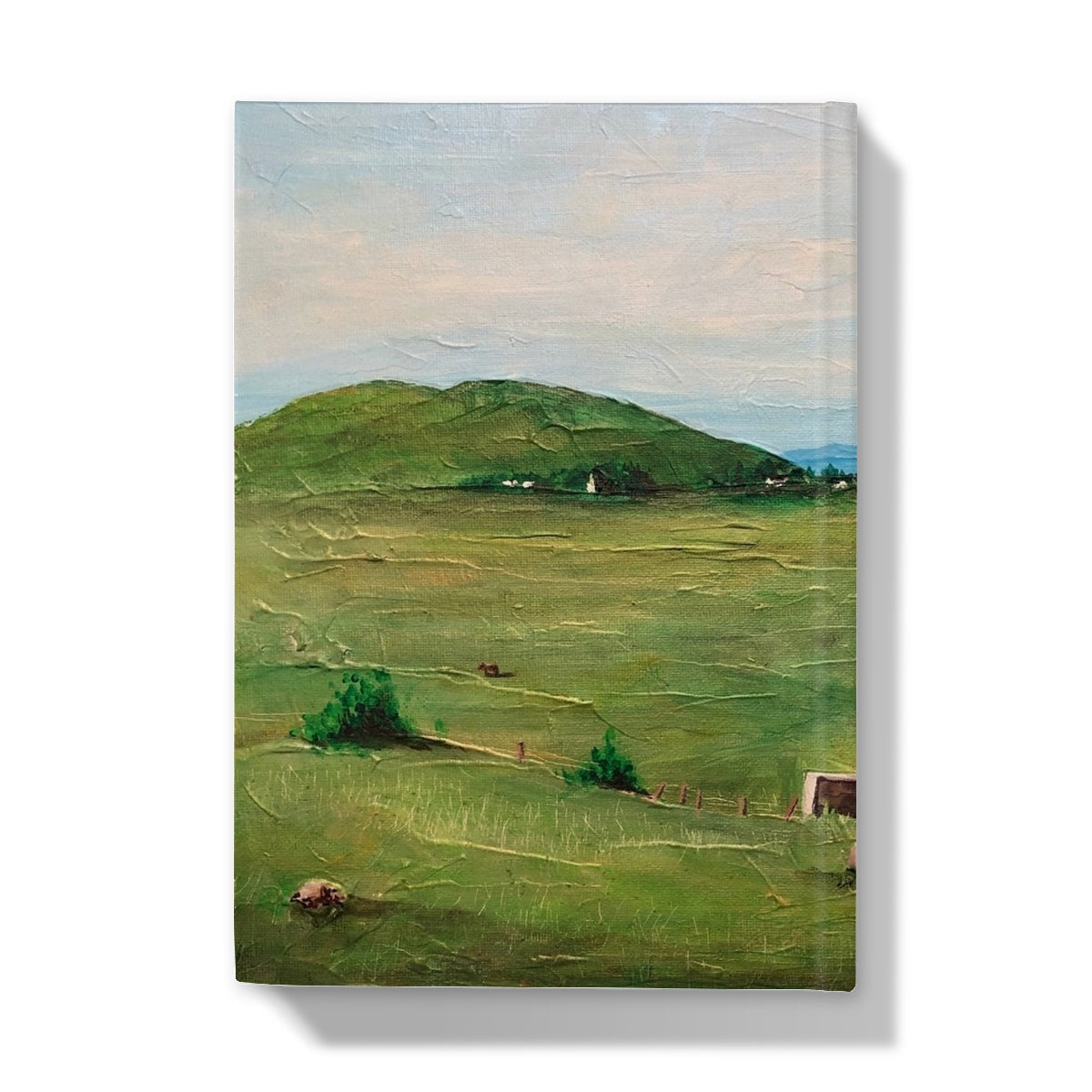 Textured oil painting on canvas of a vibrant green rural landscape on A Skye Cottage Hardback Journal