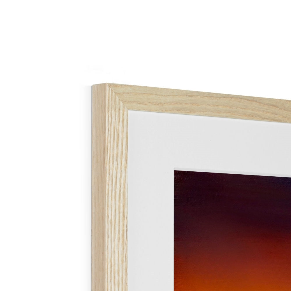 Light wood frame with white mat showcasing a dark, warm-toned Skye Sunset print