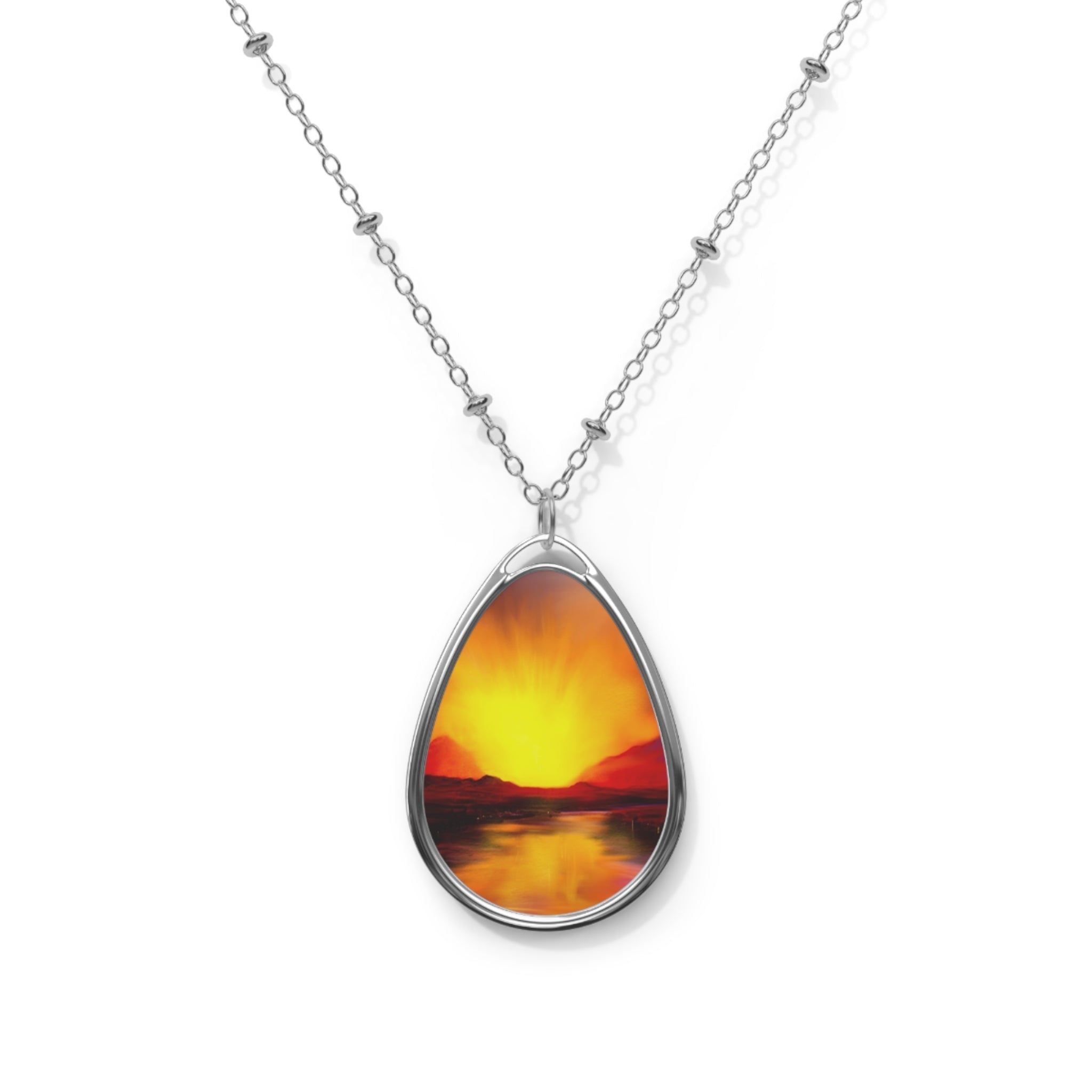 Silver chain necklace with oval pendant of a sunset over water, Skye Sunset jewelry