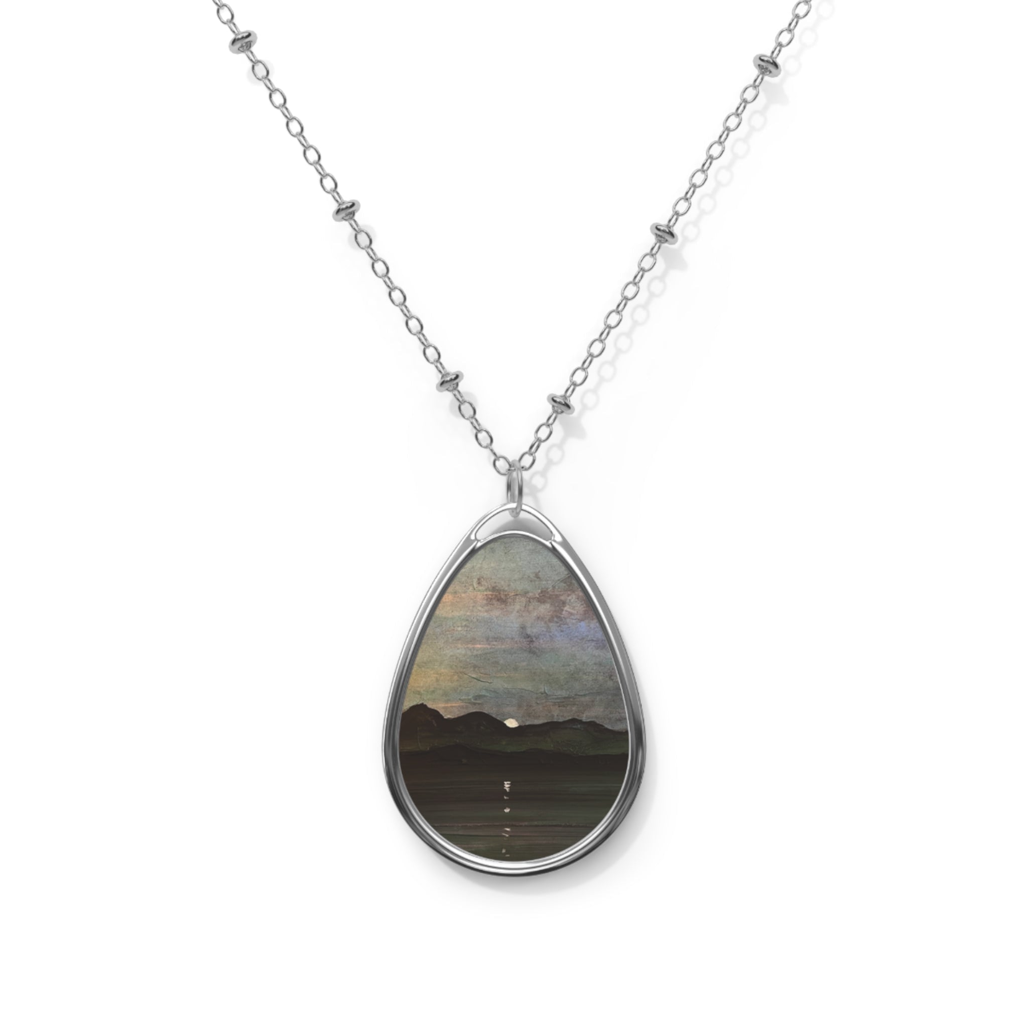 Silver chain necklace with oval pendant featuring a painted Scottish landscape scene