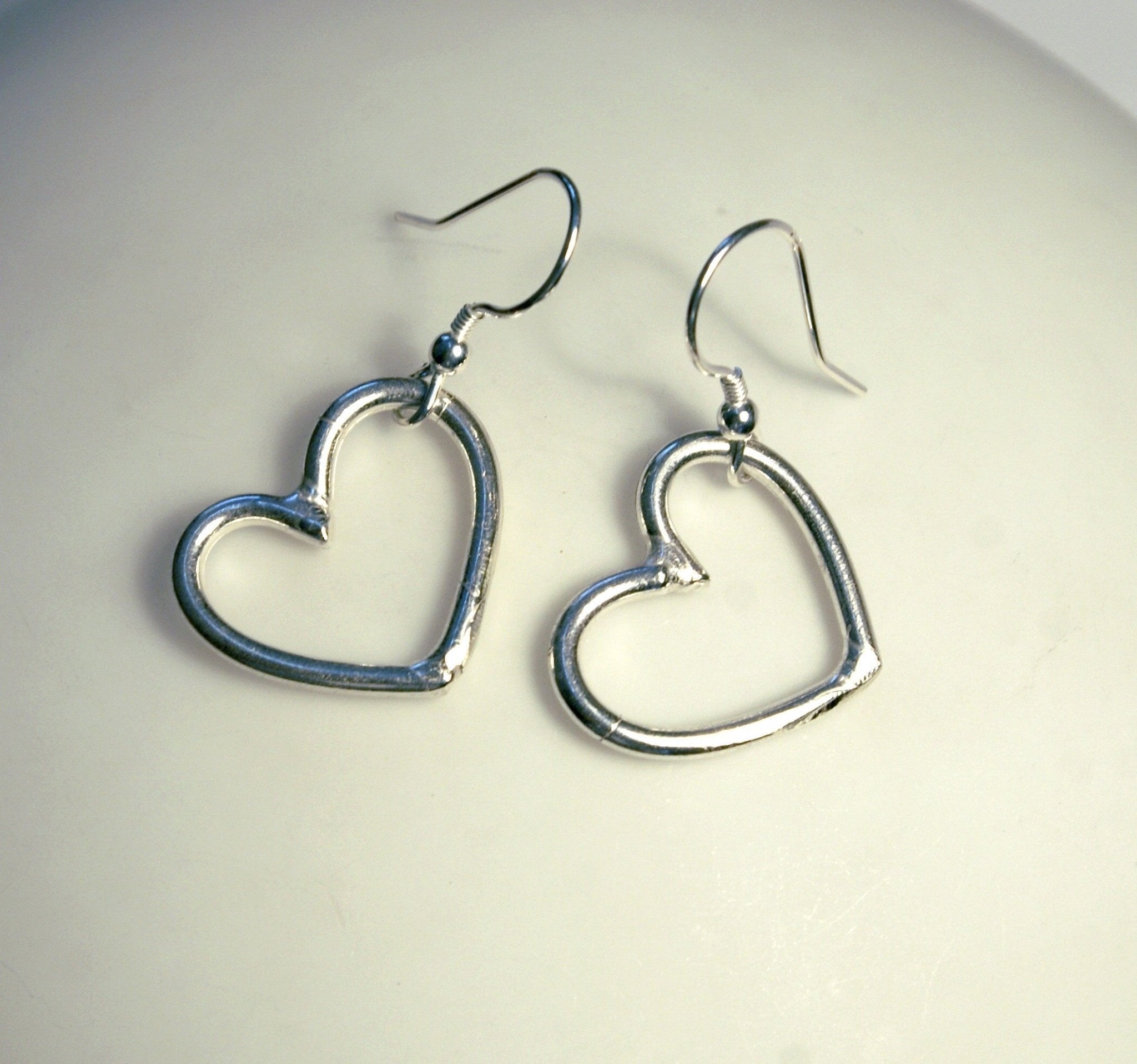 Silver small heart hoop dangle earrings with elegant smooth finish