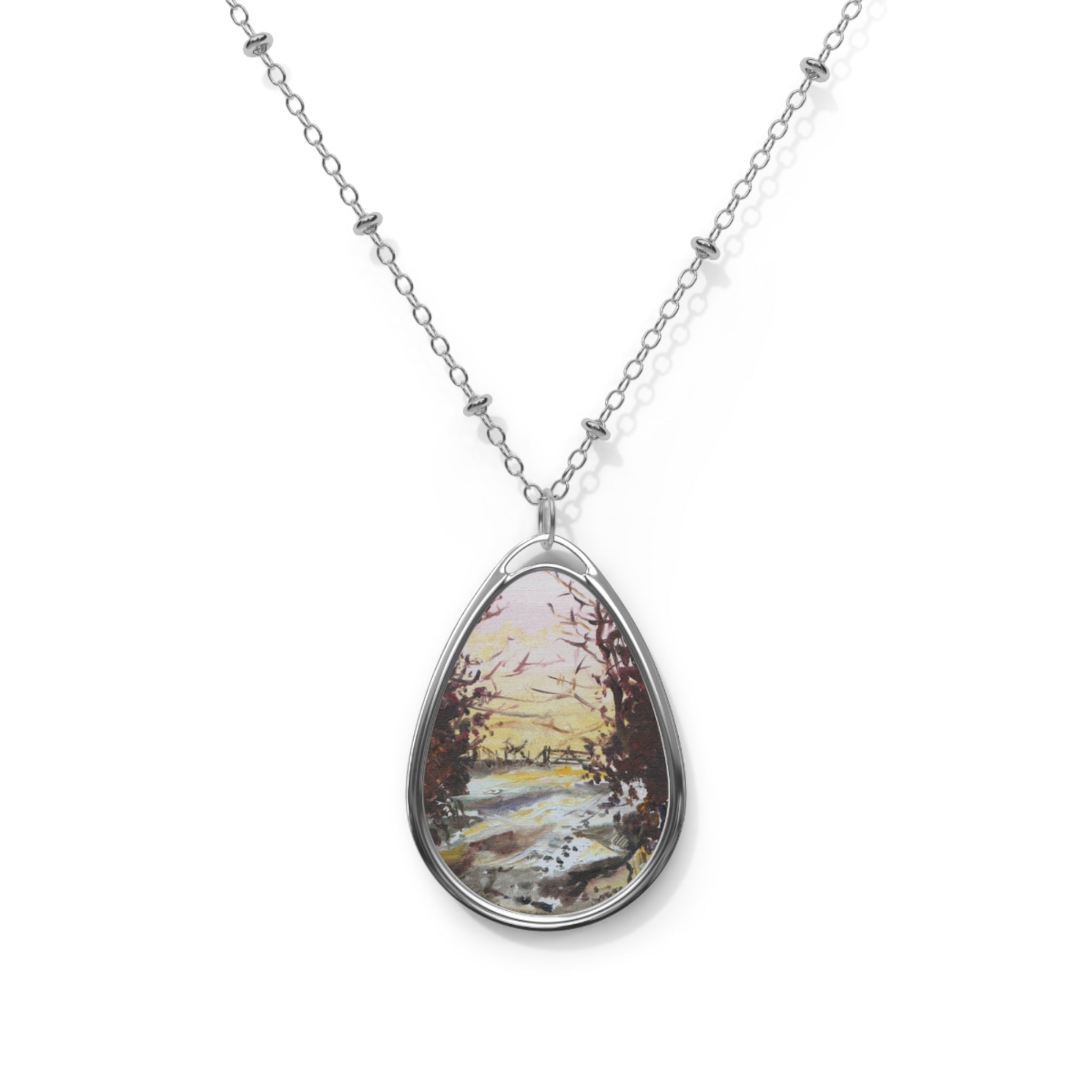 Silver teardrop pendant necklace featuring a painted winter landscape scene from Snow Above Lunderston Scottish Art Jewellery