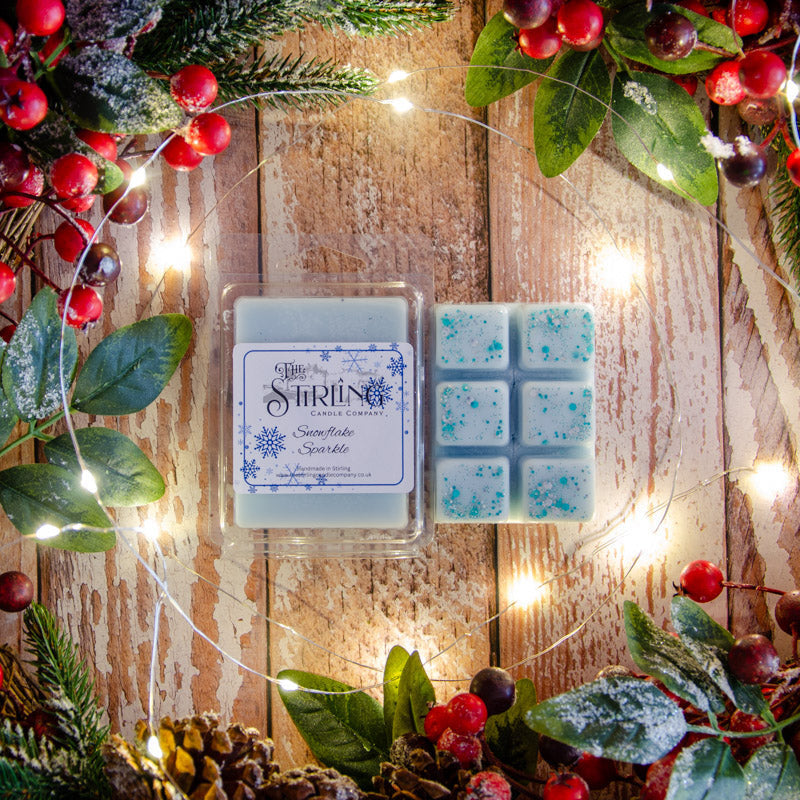 Light blue snowflake sparkle wax melt squares in clamshell from Stirling Candle Company