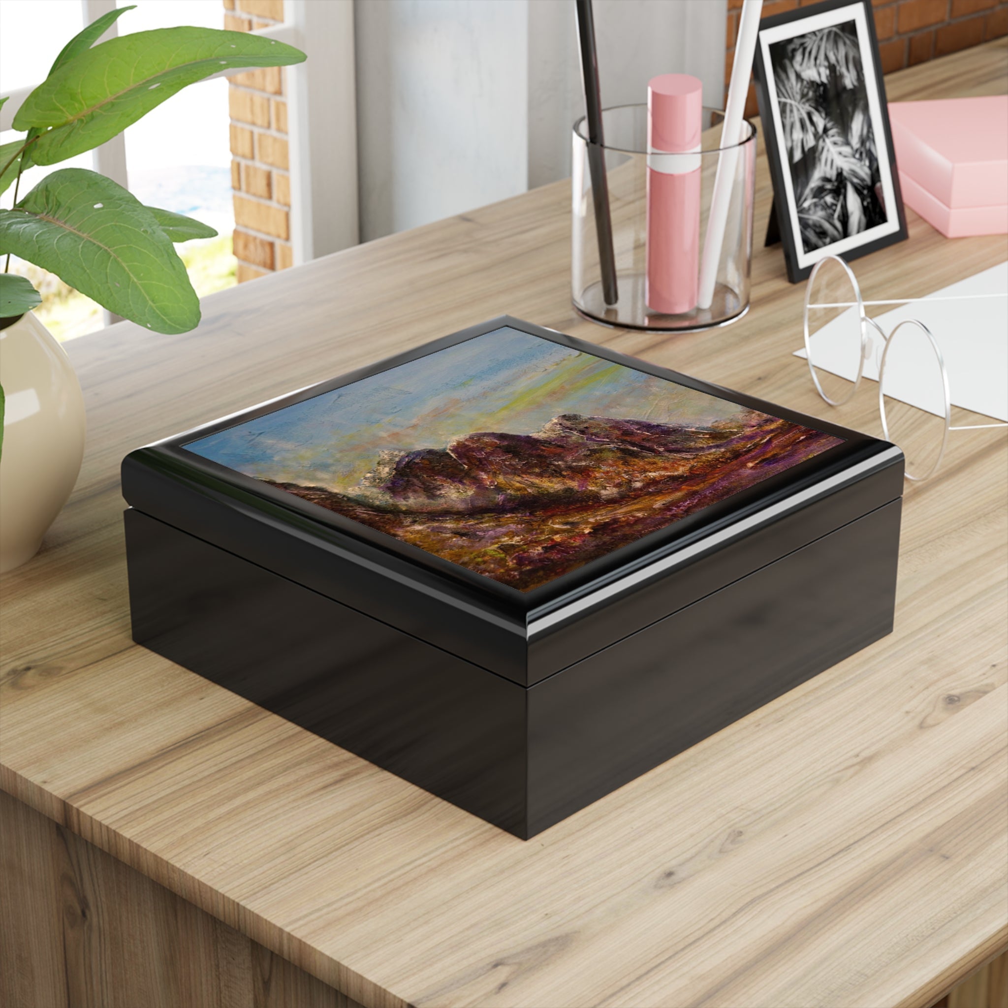 Black lacquered Three Sisters Of Glencoe jewelry box with glass top and mountain lid