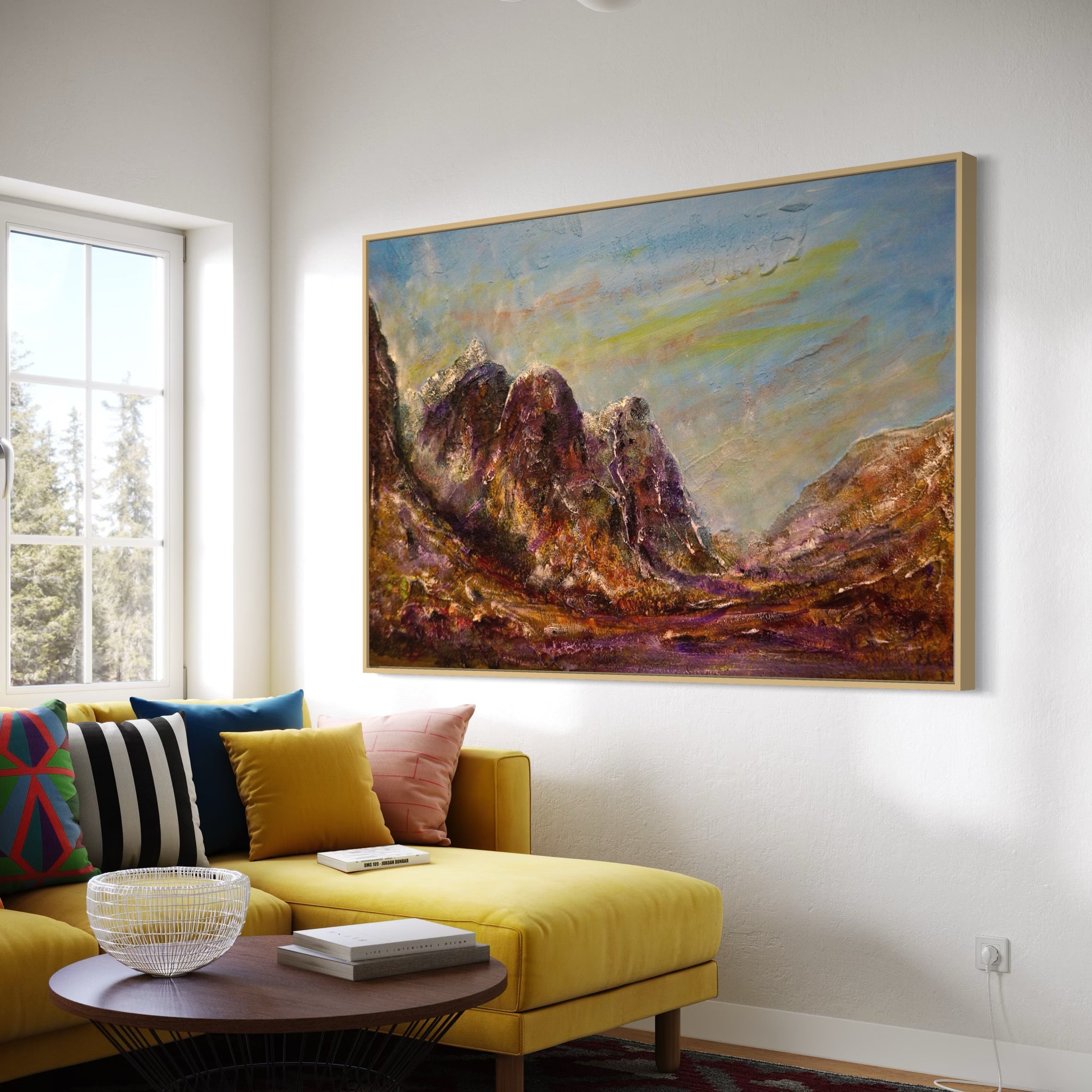 Spacious yellow sectional sofa with colorful throw pillows in The Three Sisters of Glencoe wall art setting