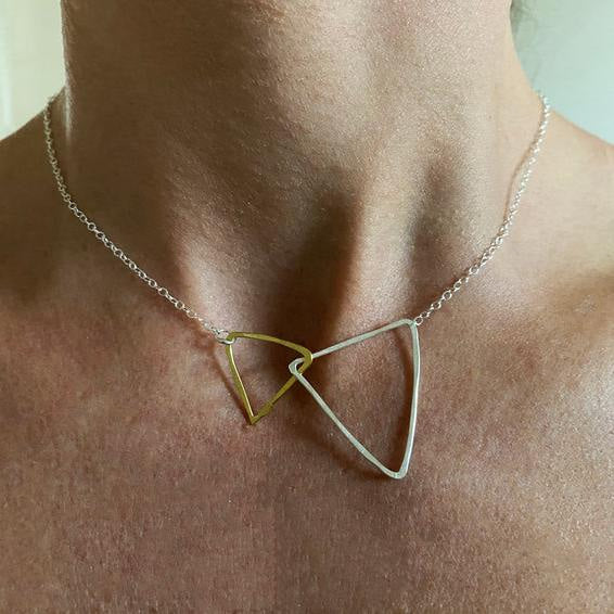 Delicate triangle necklace with gold and silver interlocking pendants