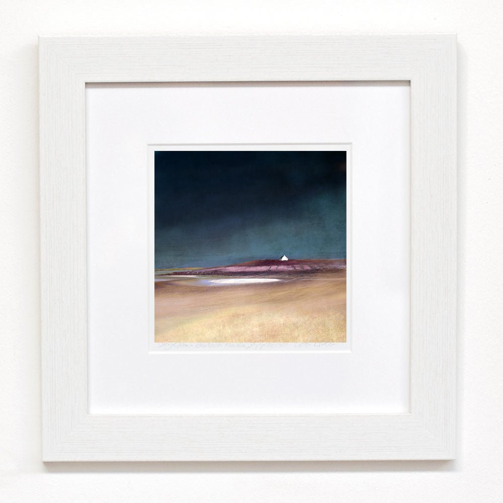 A minimalist white framed uist machair print featuring a moody landscape with deep teal skies and a white lighthouse