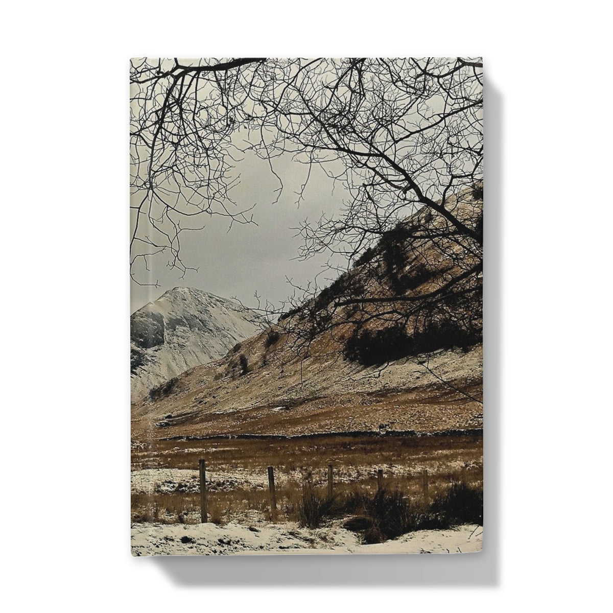 Canvas print of snowy Glencoe mountain landscape with bare trees on journal