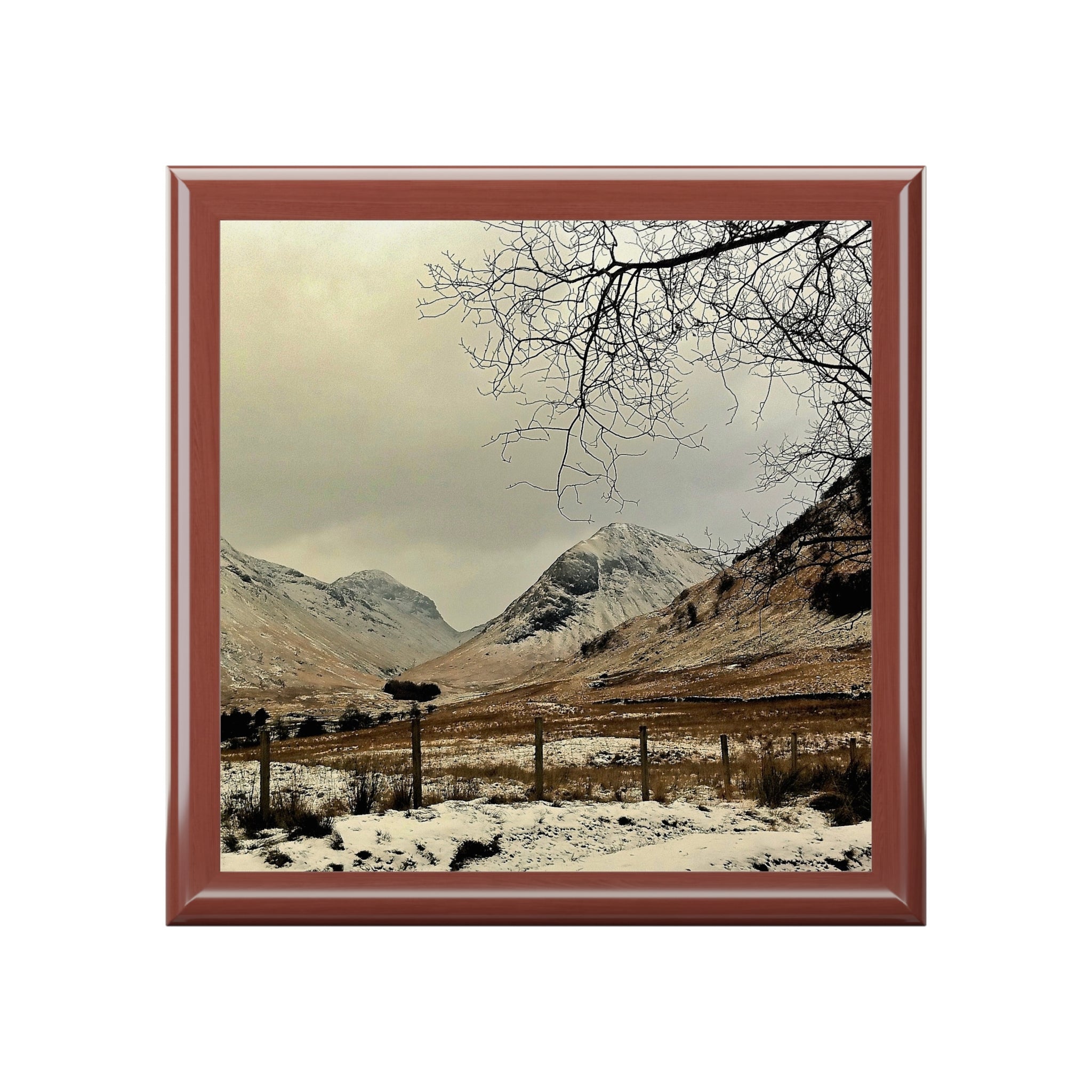 Brown wooden framed snowy mountain coaster from Winter In Glencoe Scotland