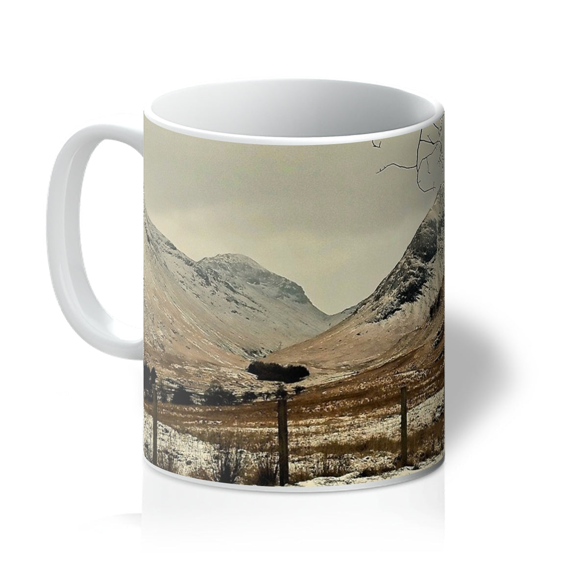 Winter In Glencoe white ceramic mug with snowy mountain peaks and tree silhouette