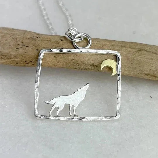 Silver wolf silhouette pendant with gold moon, hammered texture, Lindsay Mcdowall Jewellery