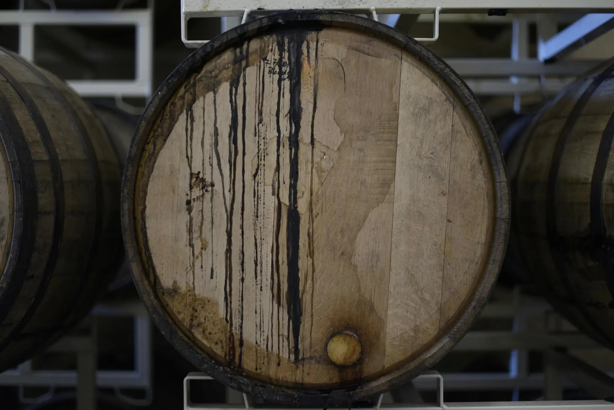Wooden whisky barrel with dark streaks and bung, from Scottish whisky distilleries map