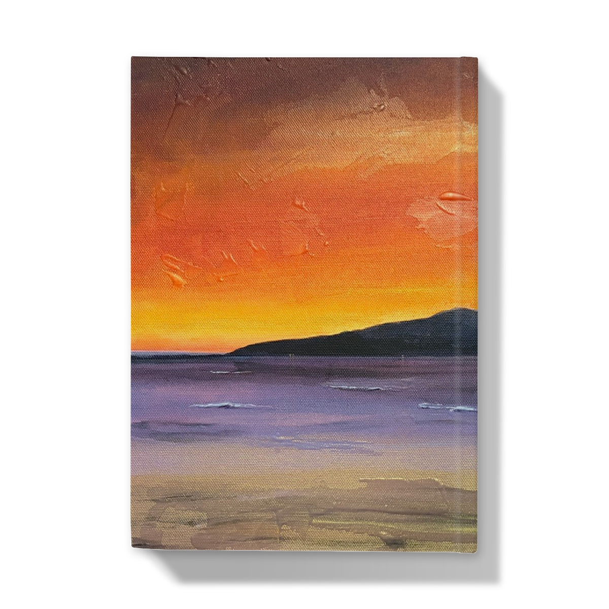 A rectangular hardback journal featuring a textured sunset canvas painting with orange yellow and purple hues and a silhouetted horizon