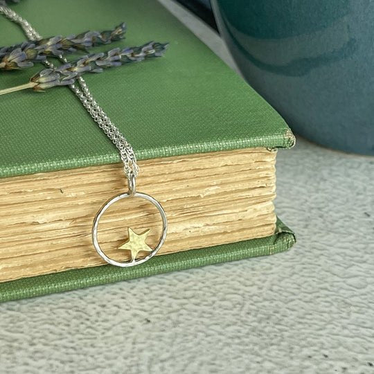 Star hoop necklace with delicate silver chain and golden star pendant