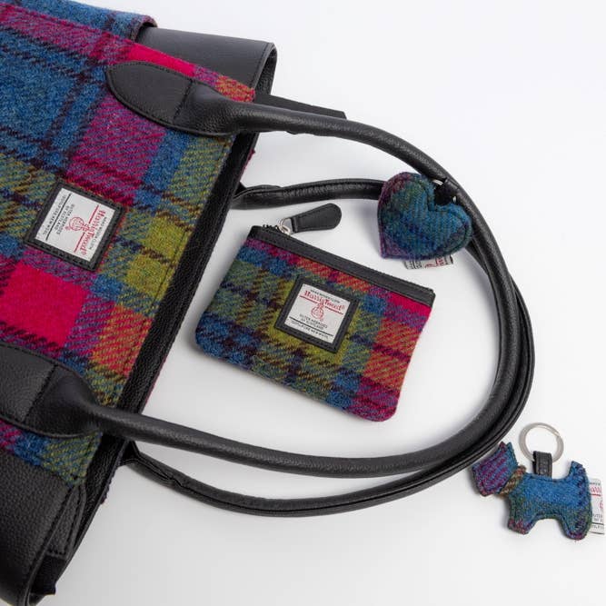 Multicolored plaid Harris Tweed handbag with black leather handles and trim in blue pink check pattern