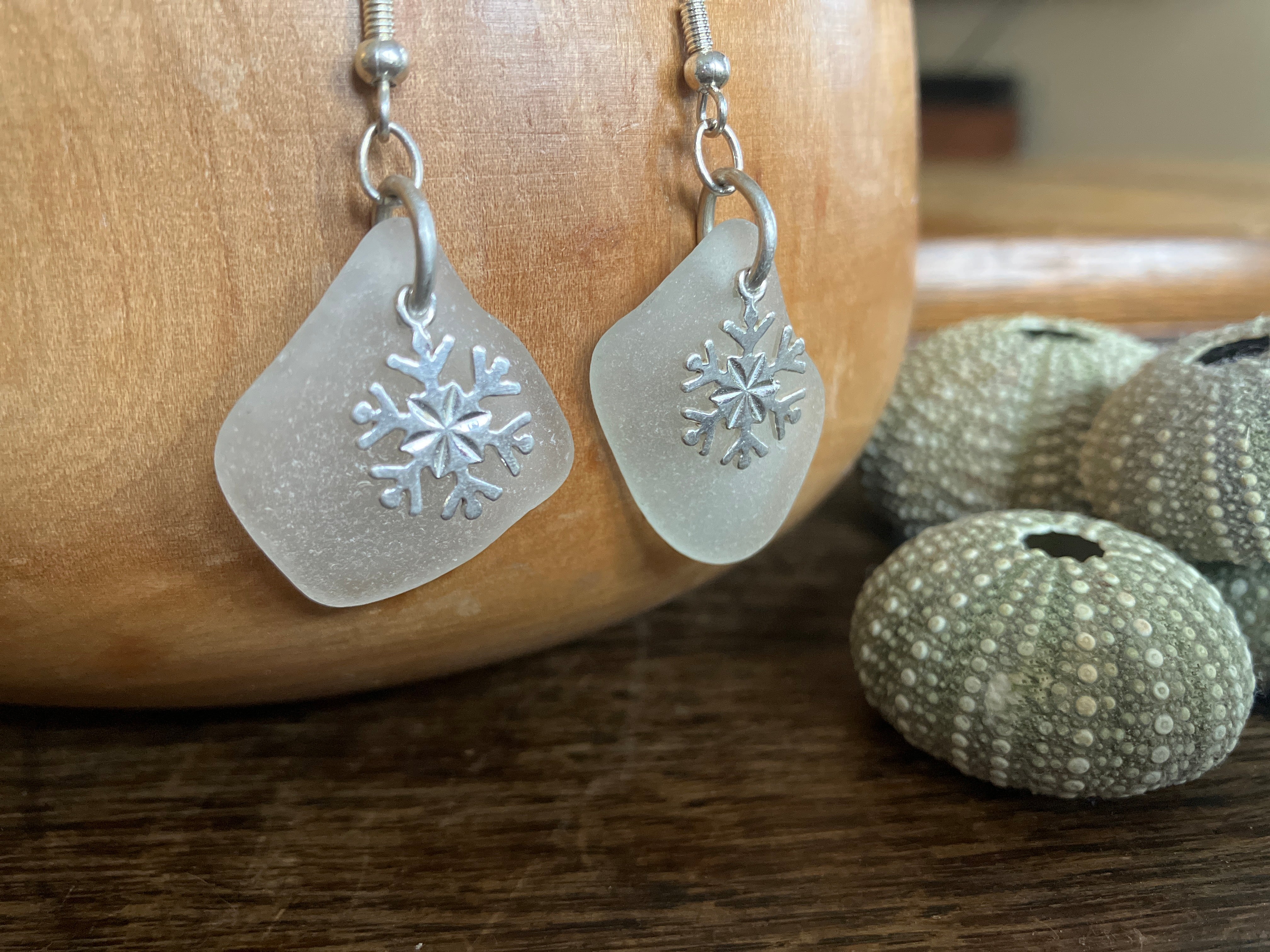 Frosted glass snowflake earrings with silver hooks