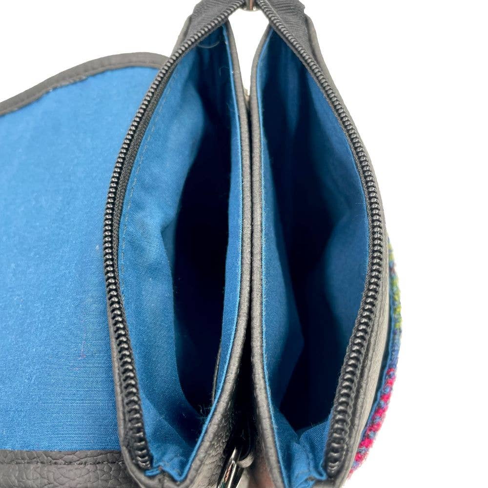 Gray textured leather Harris Tweed mini crossbody bag with vibrant blue interior lining and embroidered trim