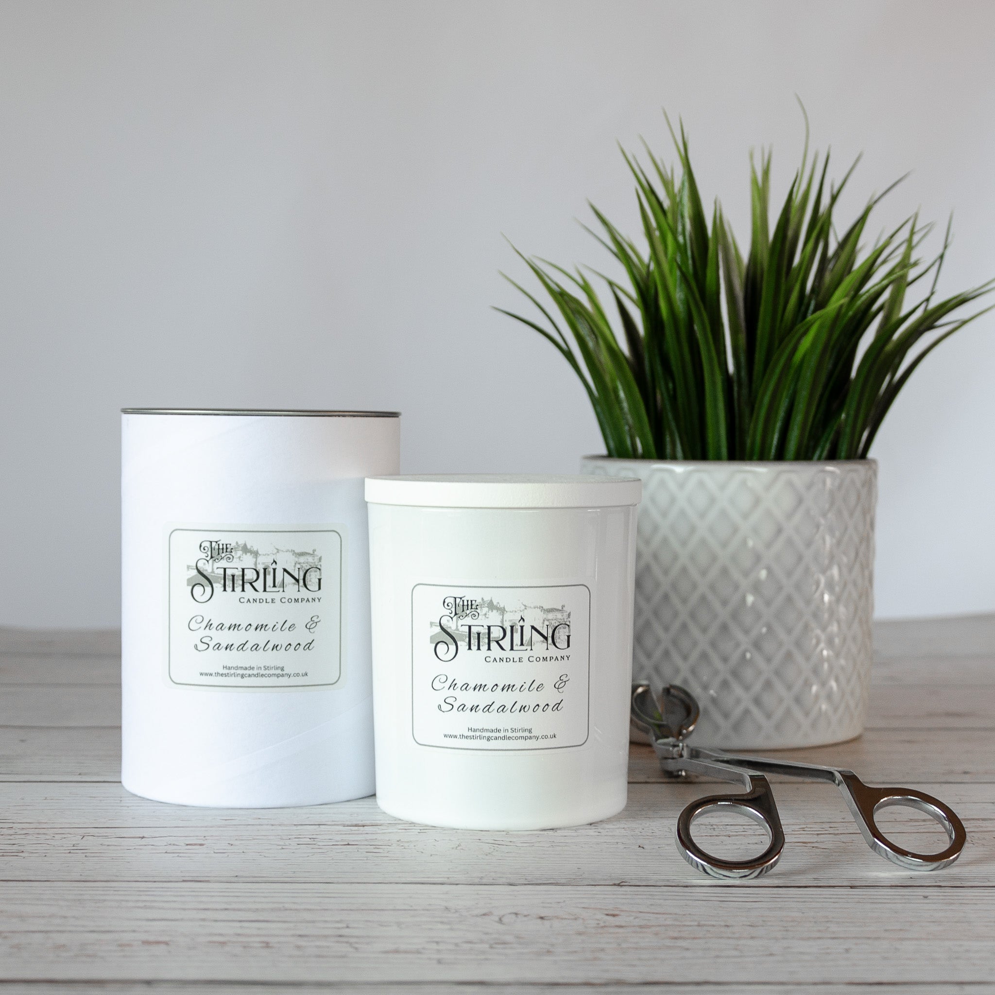 White cylindrical large candle with chamomile and sandalwood scent from the Stirling Candle Company in minimalist containers