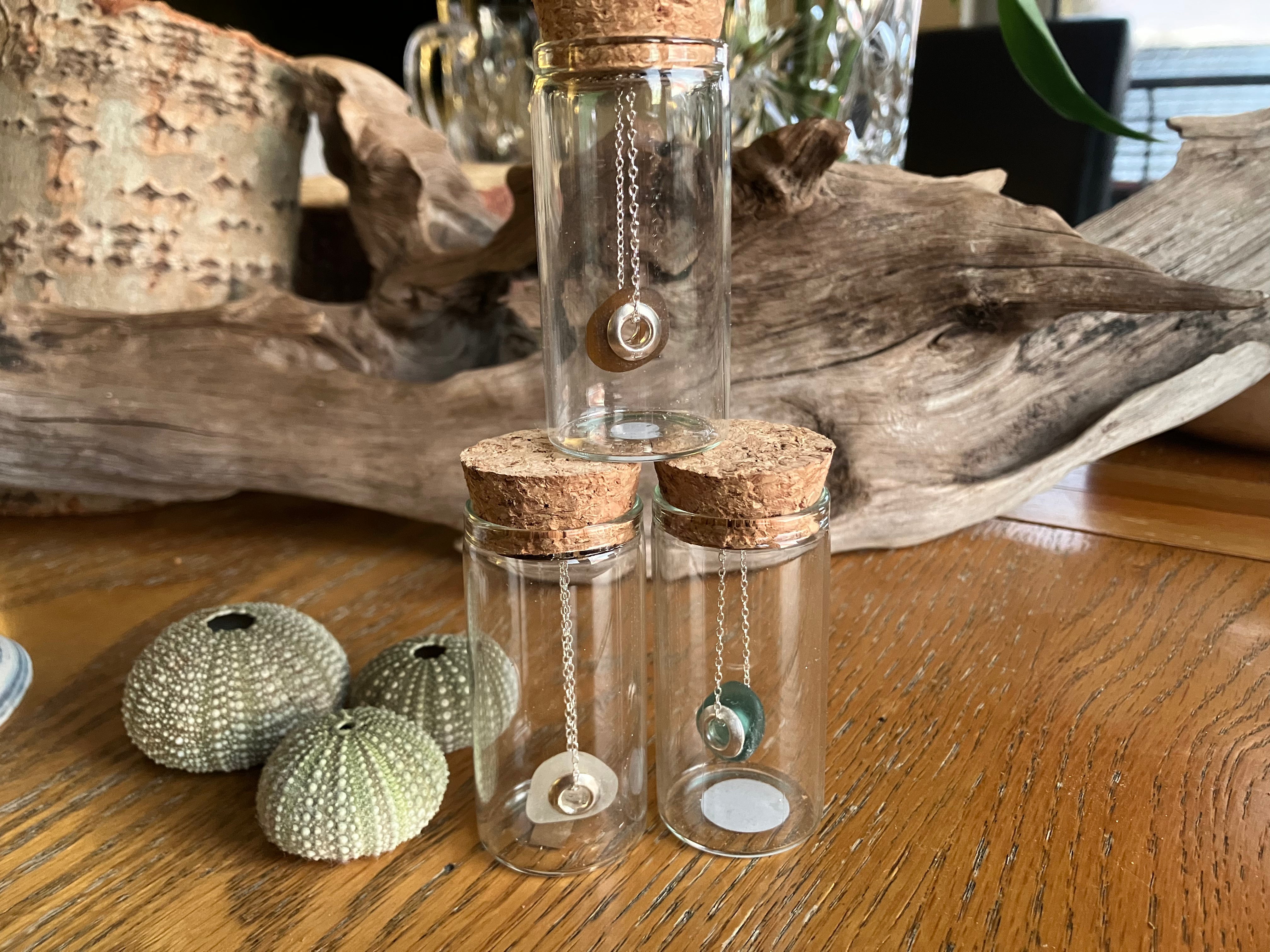 Delicate silver Pandora style seaglass charm necklace in corked glass bottle