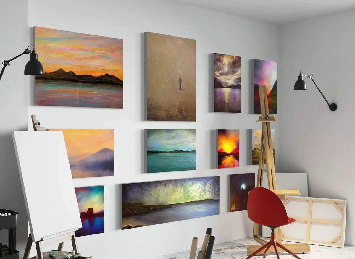 Art studio with various paintings on the wall and a chair.