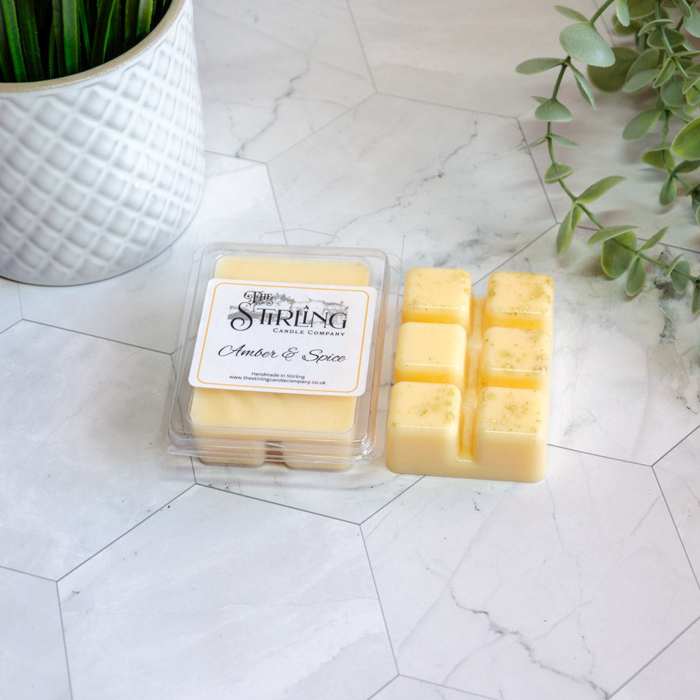 Amber & Spice wax melt clamshell with 6 yellow amber spice-scented cubes