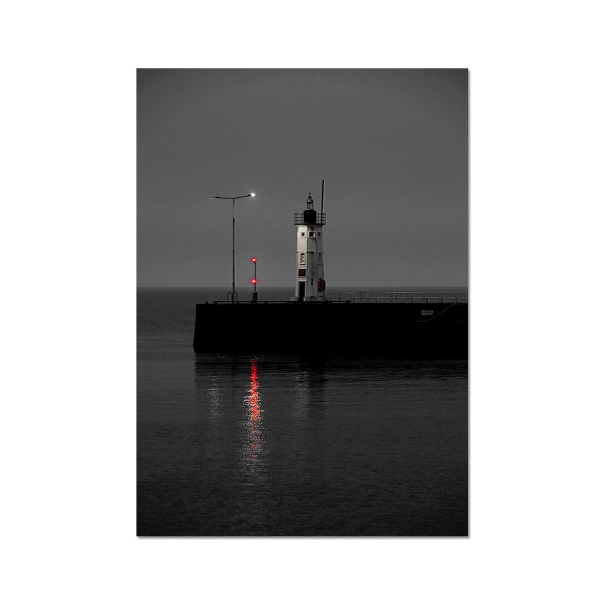 Anstruther Lighthouse red fine art print: white tower with black trim on dark pier, glowing red light reflecting in calm water