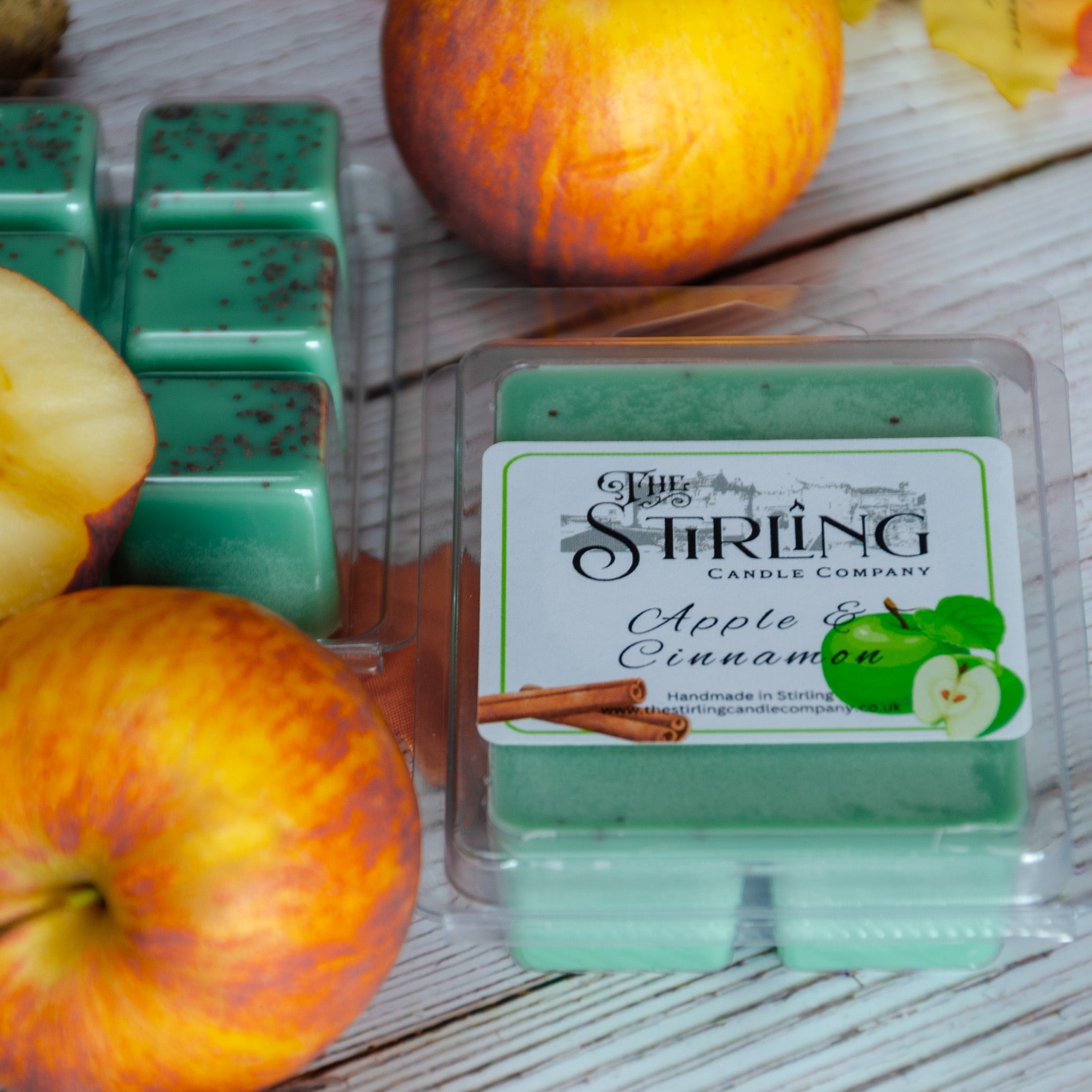 Apple and cinnamon wax melt clamshell with green apple and cinnamon scent in a clear plastic container from stirling candle company