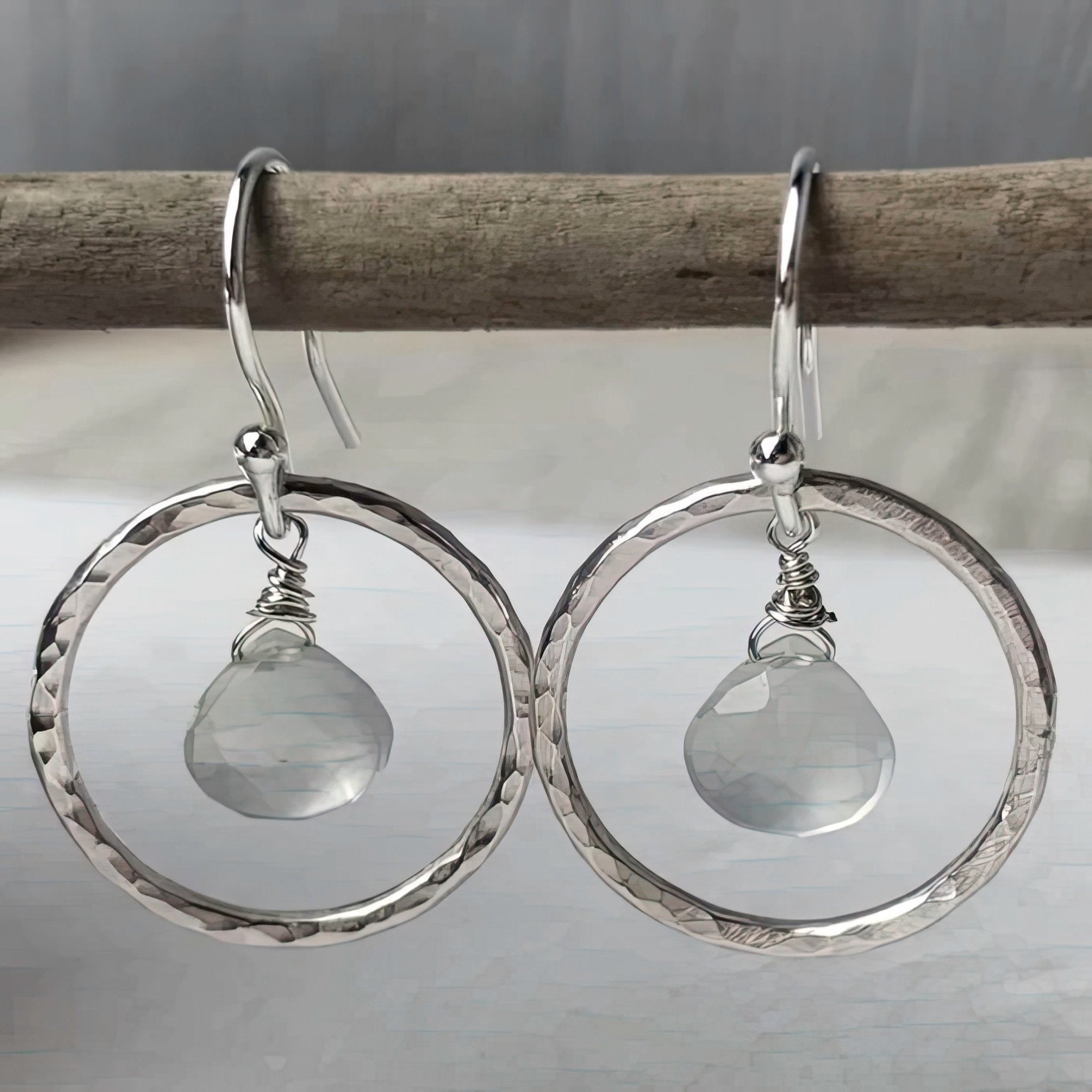 Silver hammered hoop earrings with dangling aqua chalcedony teardrops