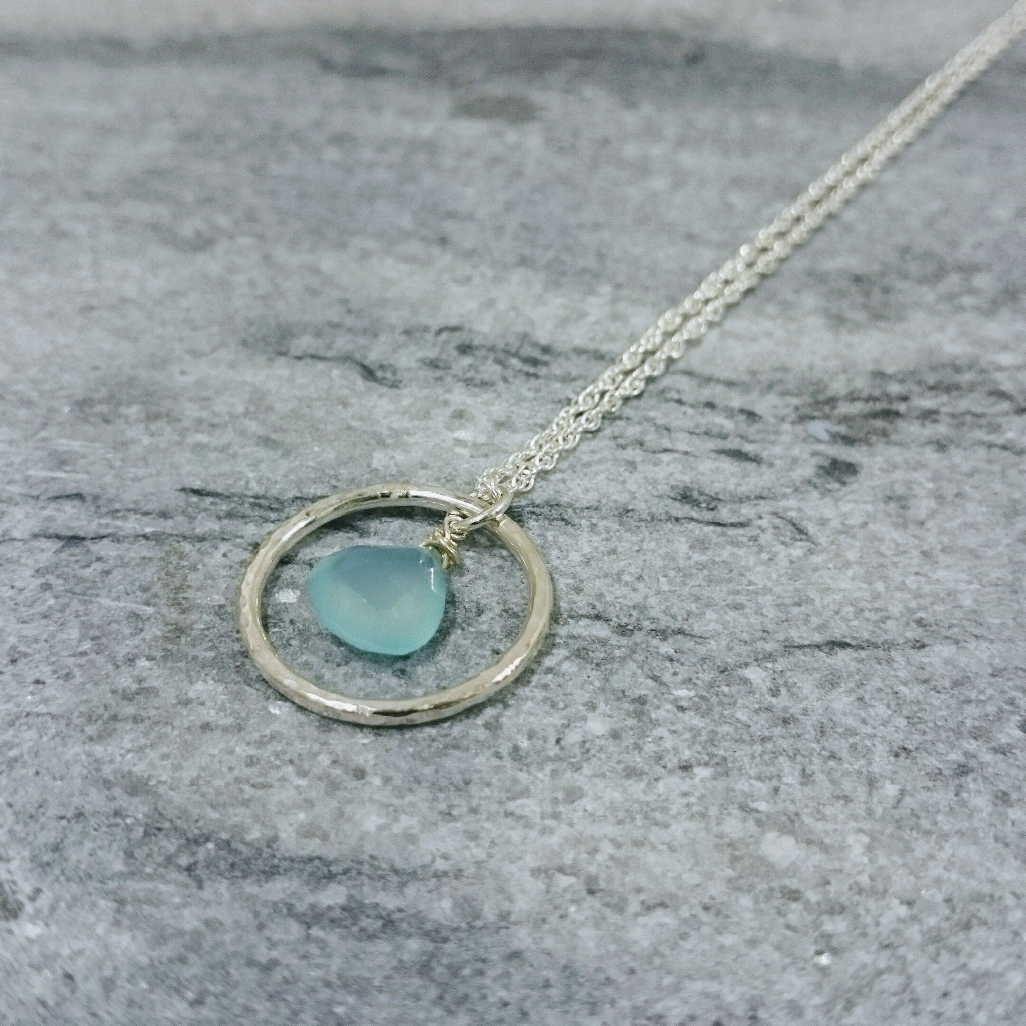 Delicate silver Aqua Stone Hoop Necklace with hammered pendant and dangling light blue gem