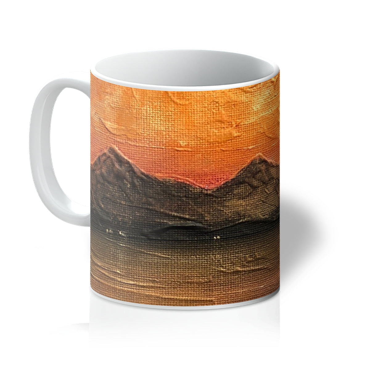White ceramic Arran Summer Nights mug with textured orange-brown sunset mountains over water
