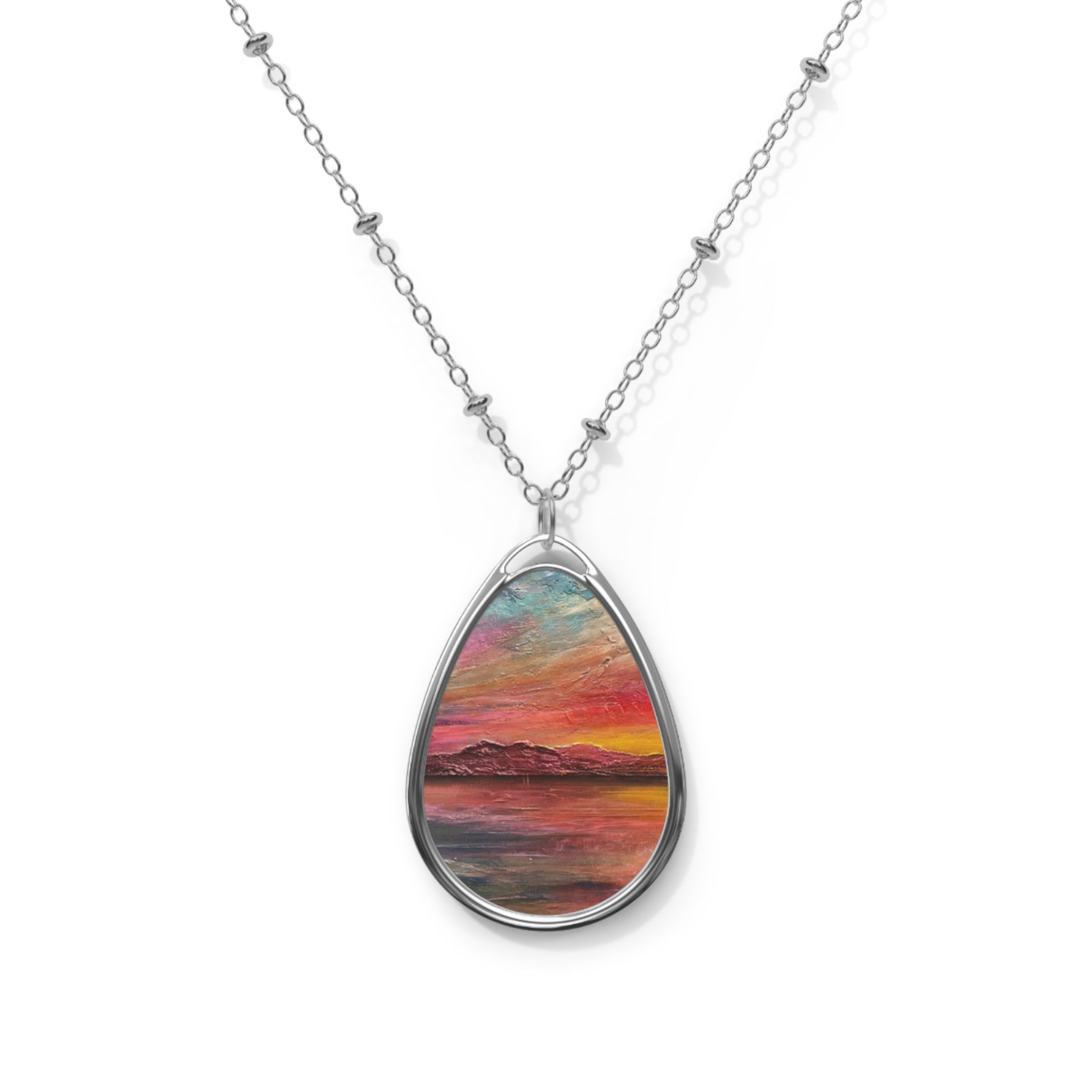 Arran Sunset II silver teardrop necklace with vibrant sunset landscape on water
