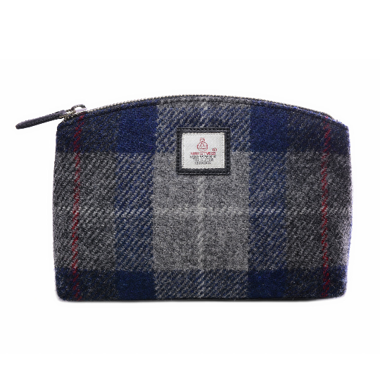A navy blue grey and red plaid woolen zippered pouch with a white label front suitable as a harris tweed cosmetic bag
