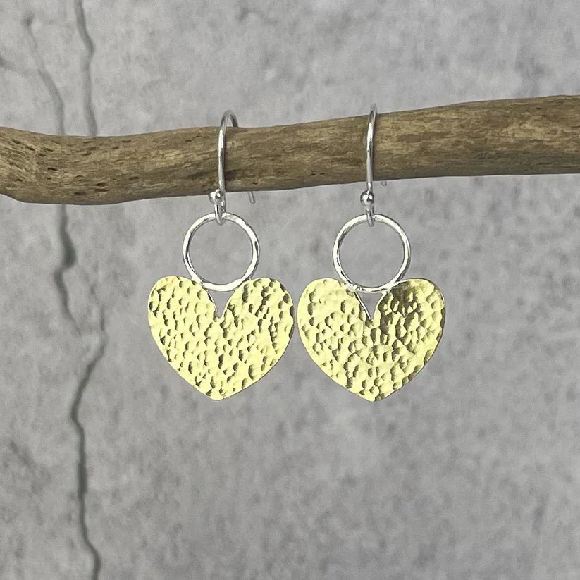 Beaten Brass Heart Earrings with hammered gold finish and silver hoops
