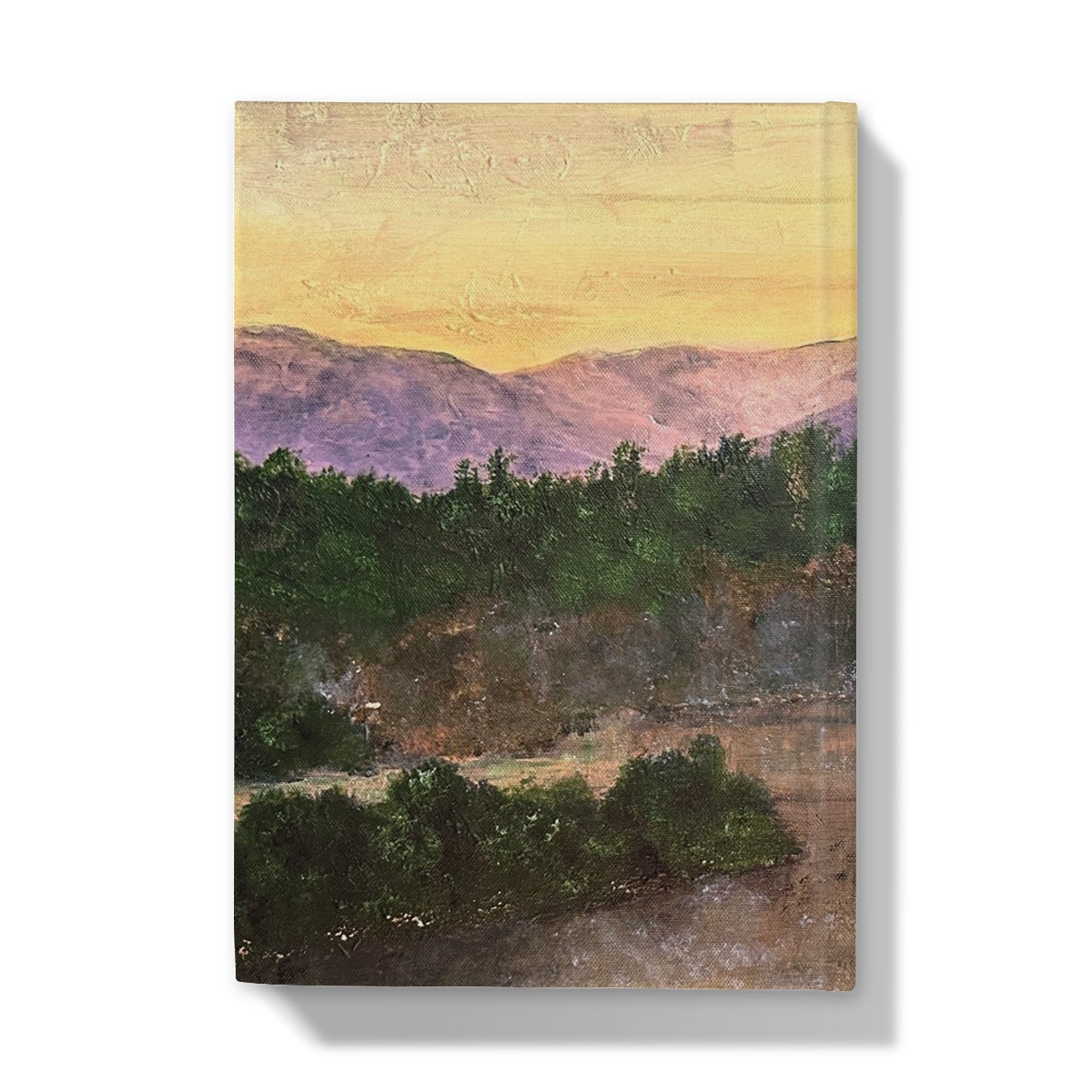 Canvas print of a mountain landscape with green trees and purple mountains in an Orange Sky for Ben Tee Invergarry Hardback Journal