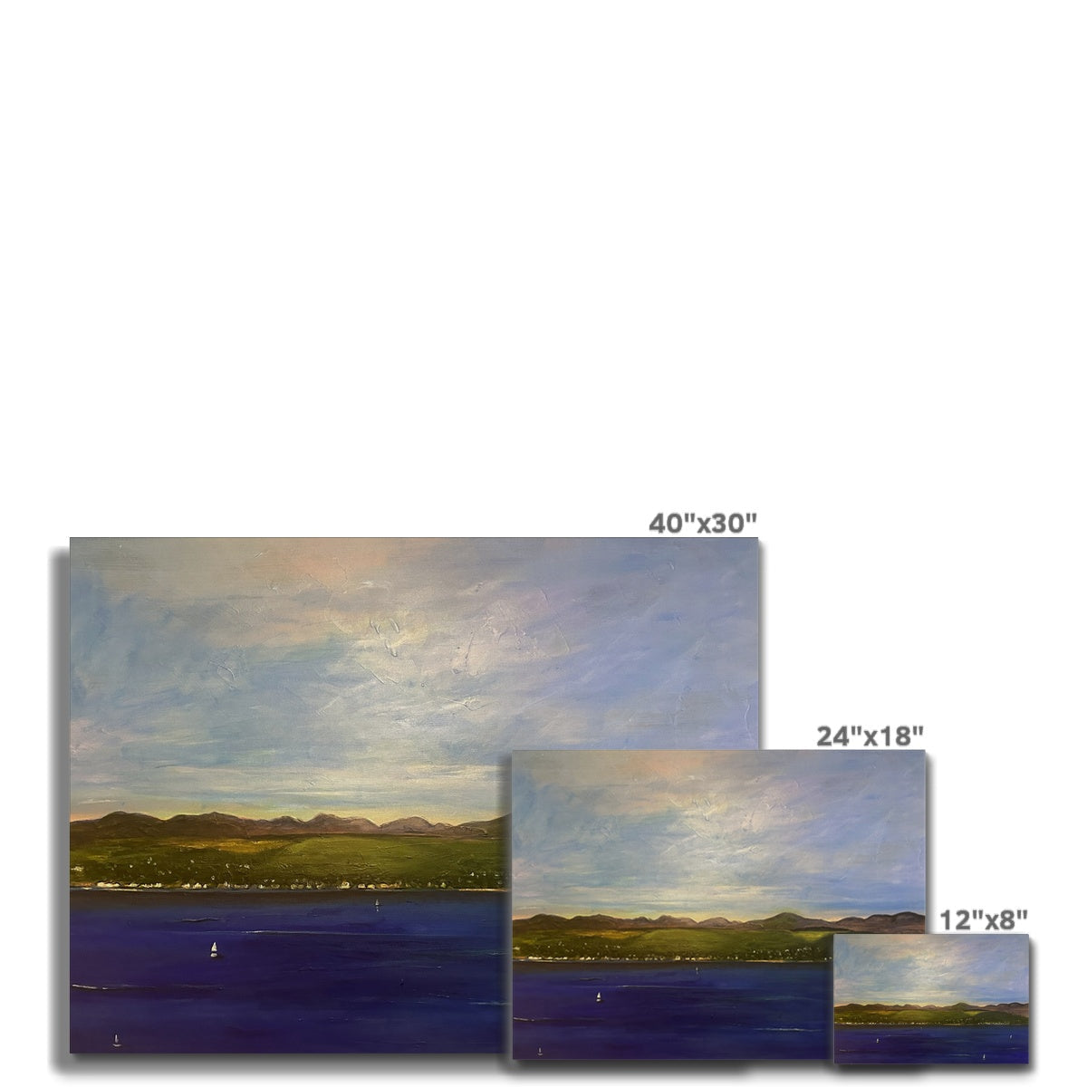 Three canvas prints of a landscape painting in different sizes displayed with The Biggie Canvas