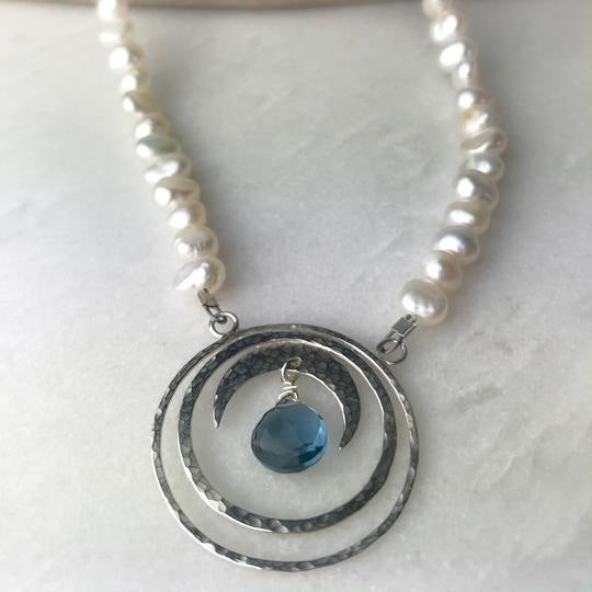 Silver-toned crescent moon necklace with blue topaz gem, pearls by Lindsay Mcdowall Jewellery